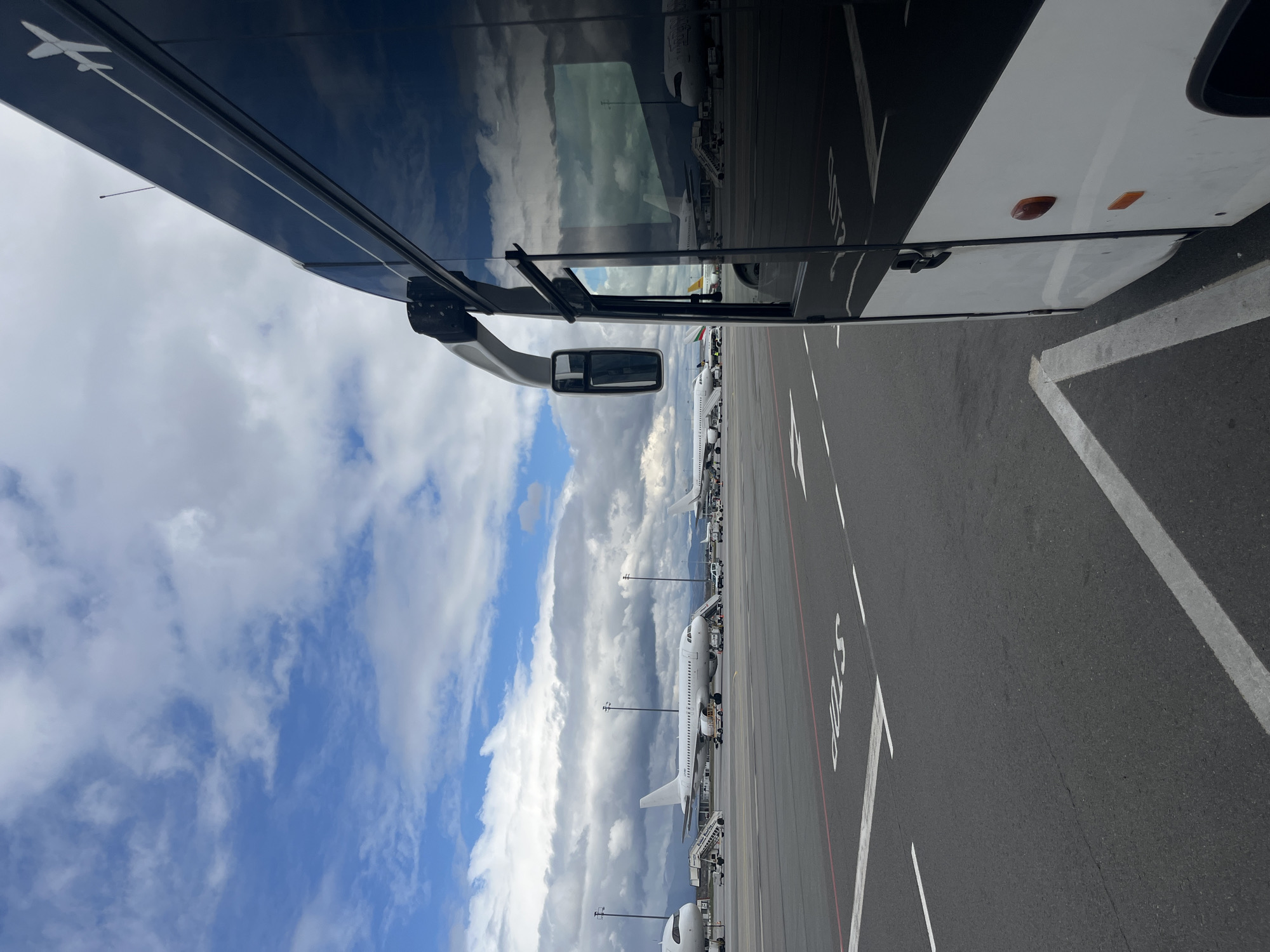 Bus passenger observes aircraft at Sofia Airport tarmac