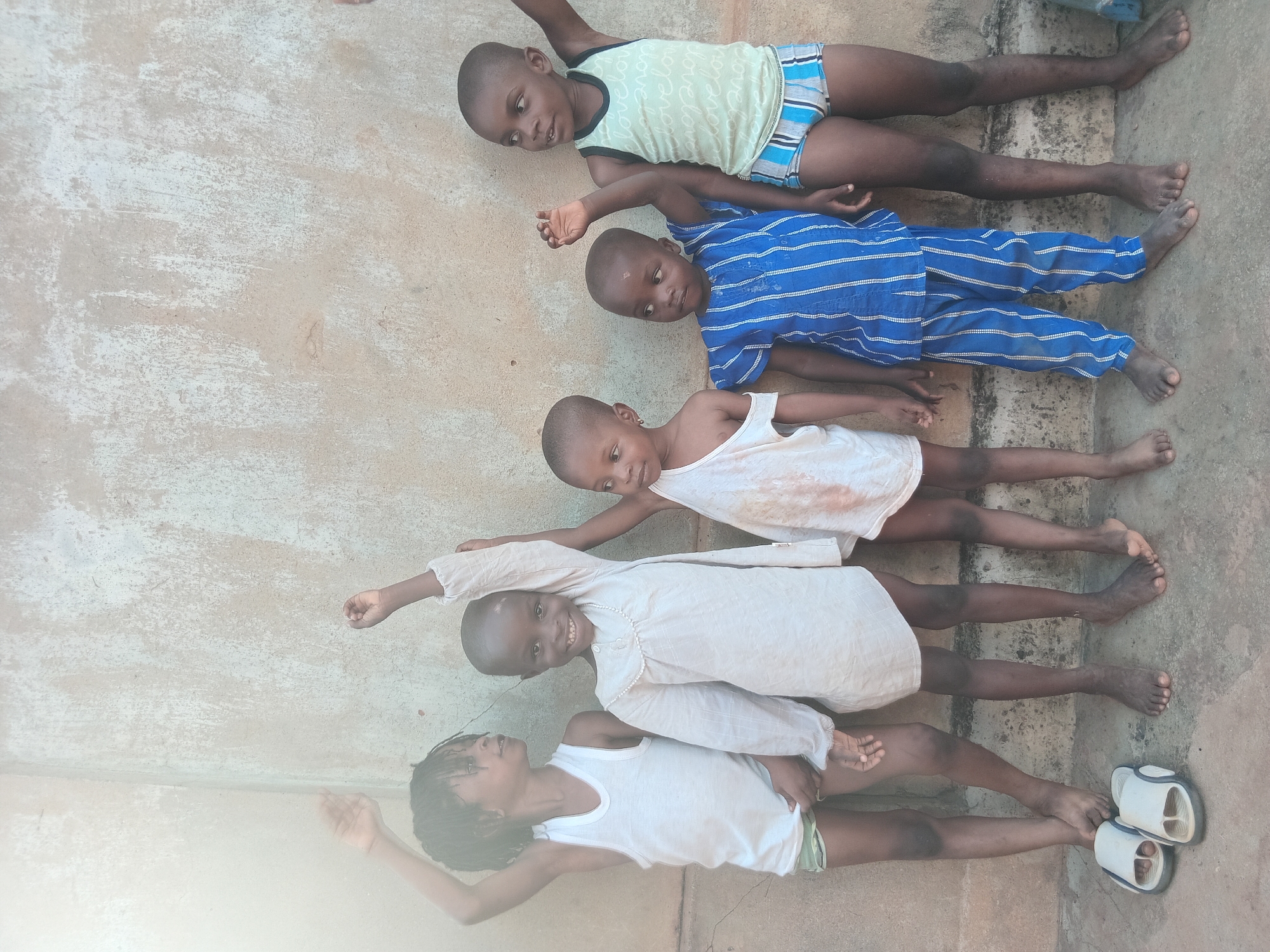 Children photographed in residential Shagamu, Nigeria neighborhood
