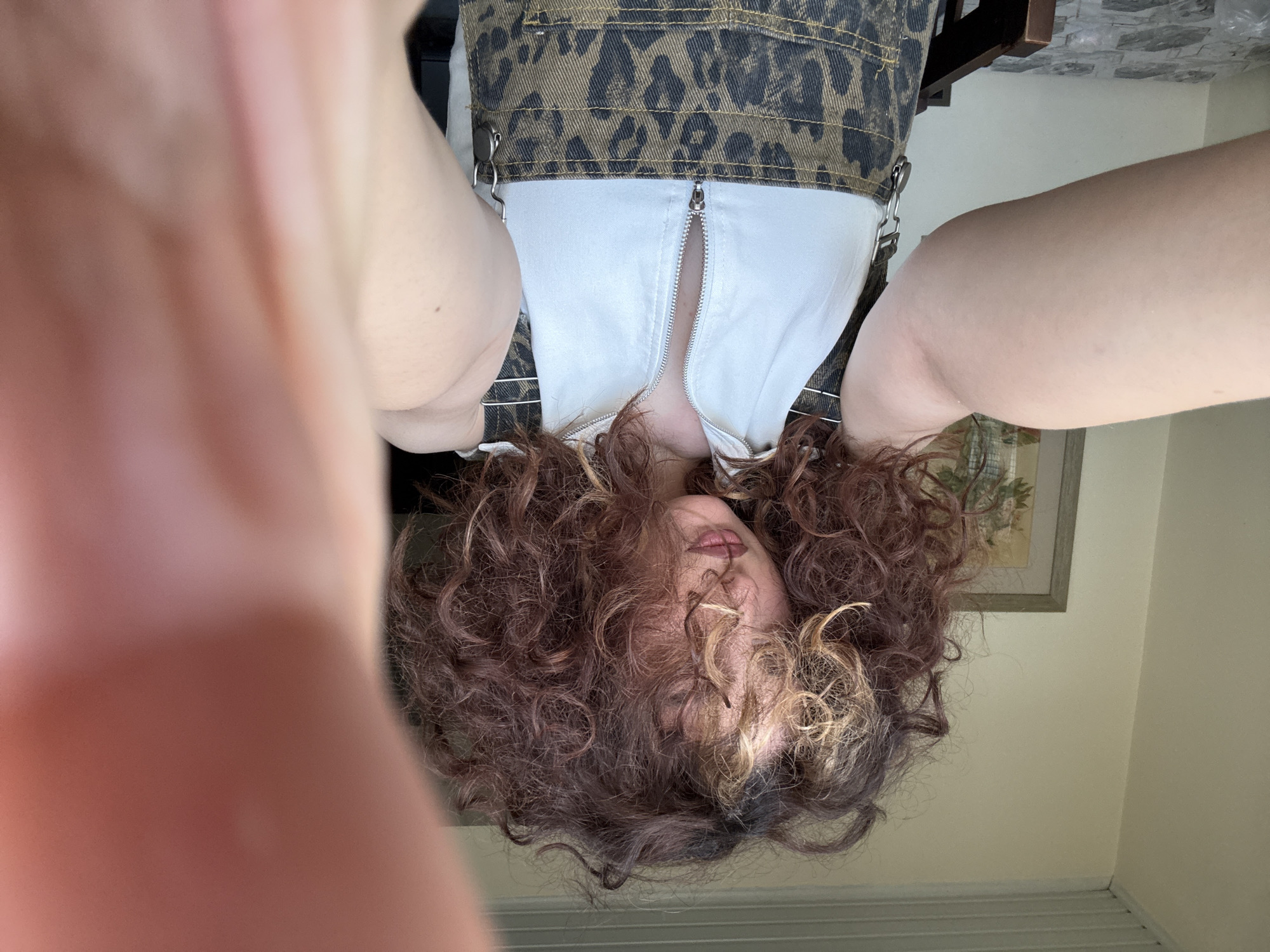 Person photographed upside down in Yerevan interior setting