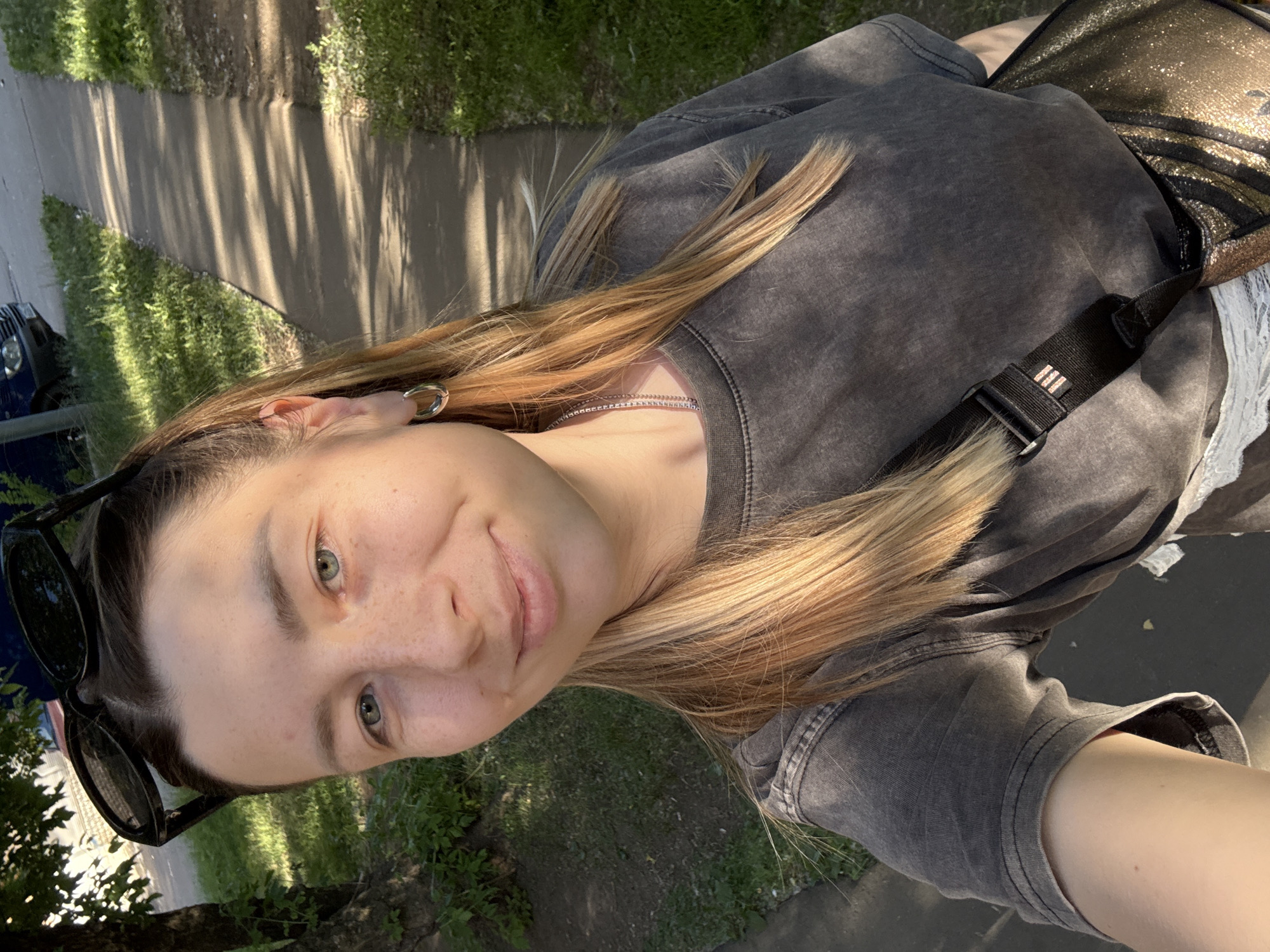 Woman Takes Multiple Selfies in Moscow During Afternoon Session