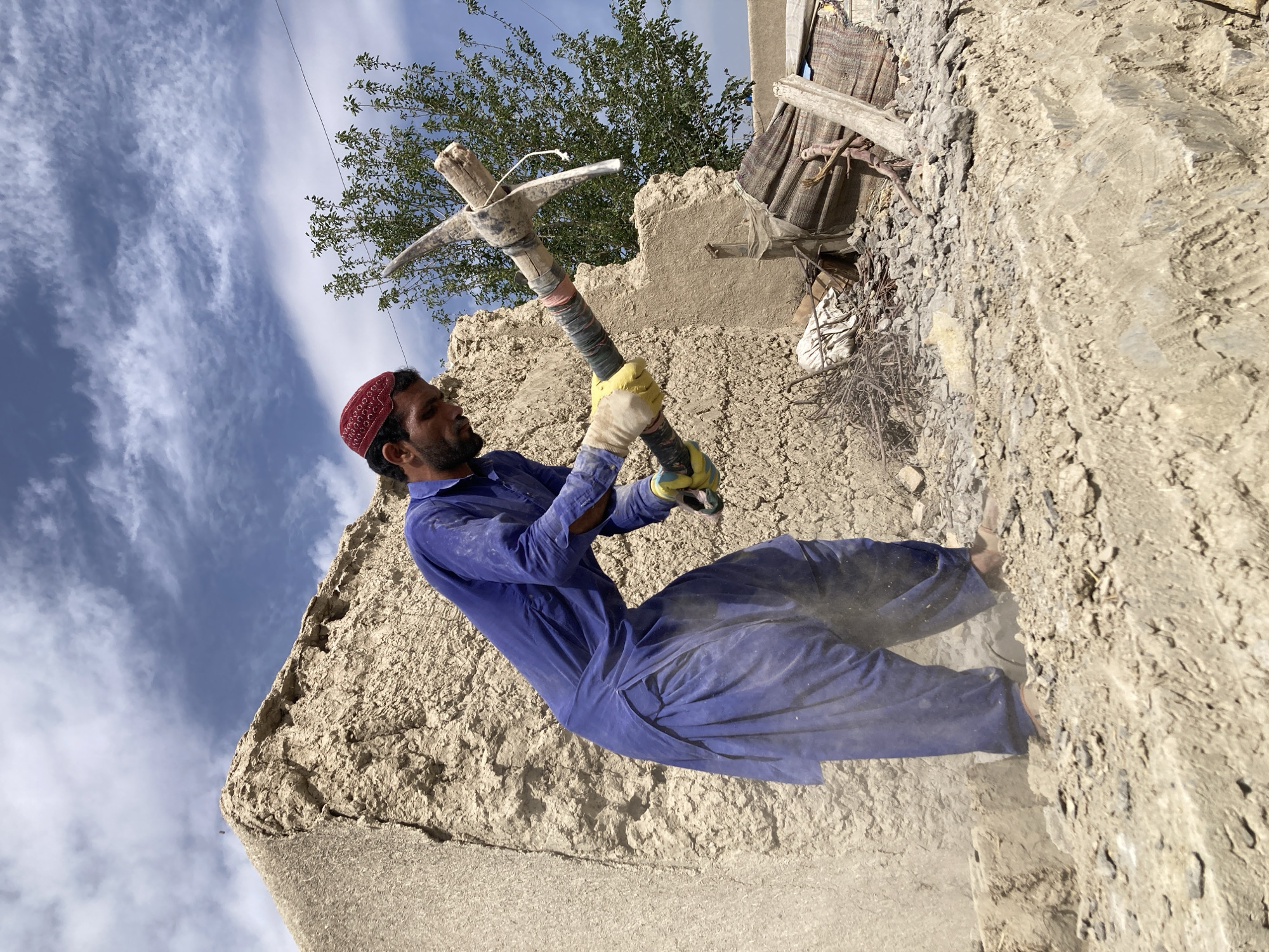 Workers demolish structures at Qilla Saifullah construction site
