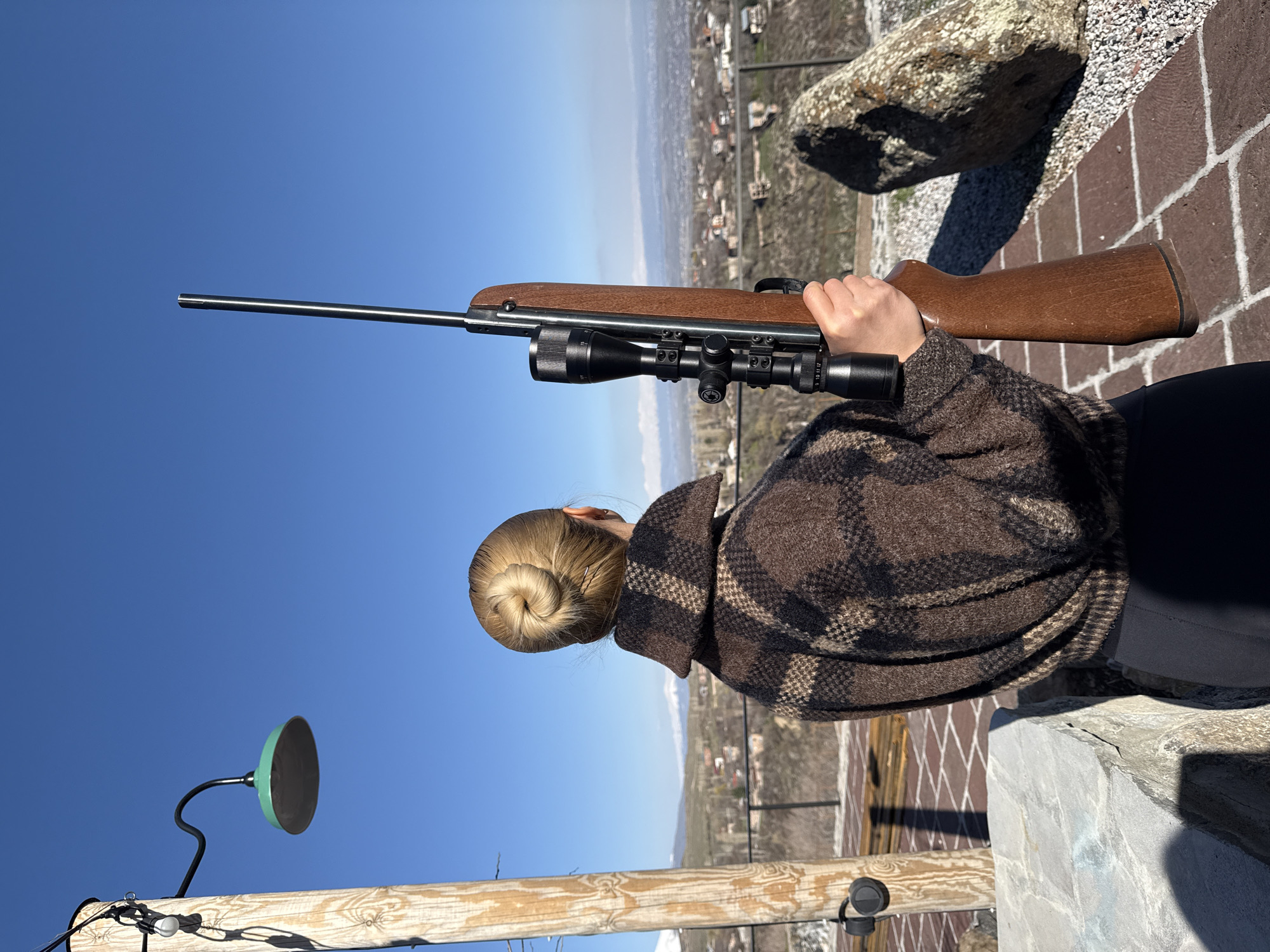 Woman with rifle spotted in outdoor scene in Byurakan
