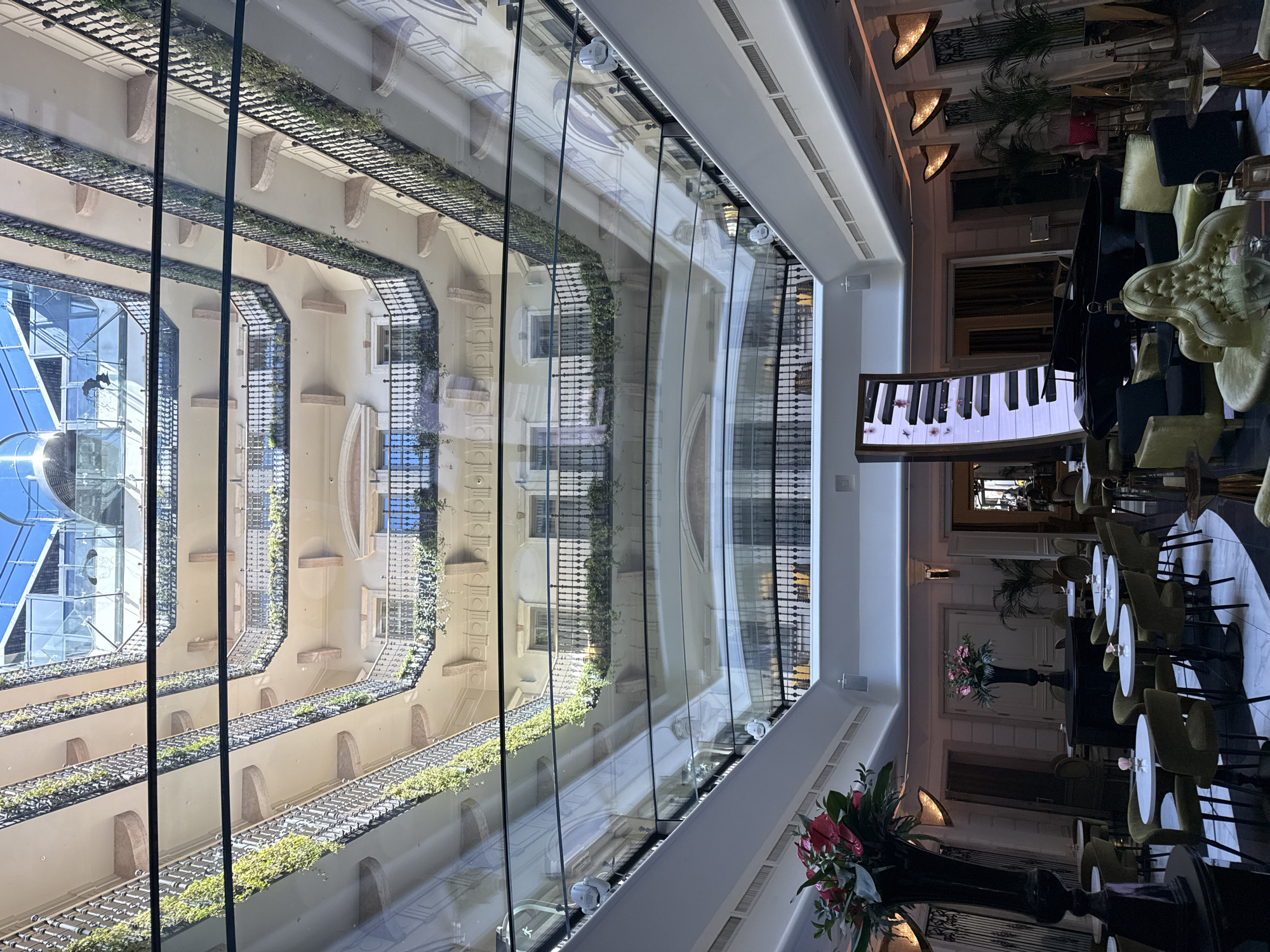 Luxury hotel lobby with grand piano documented in Budapest