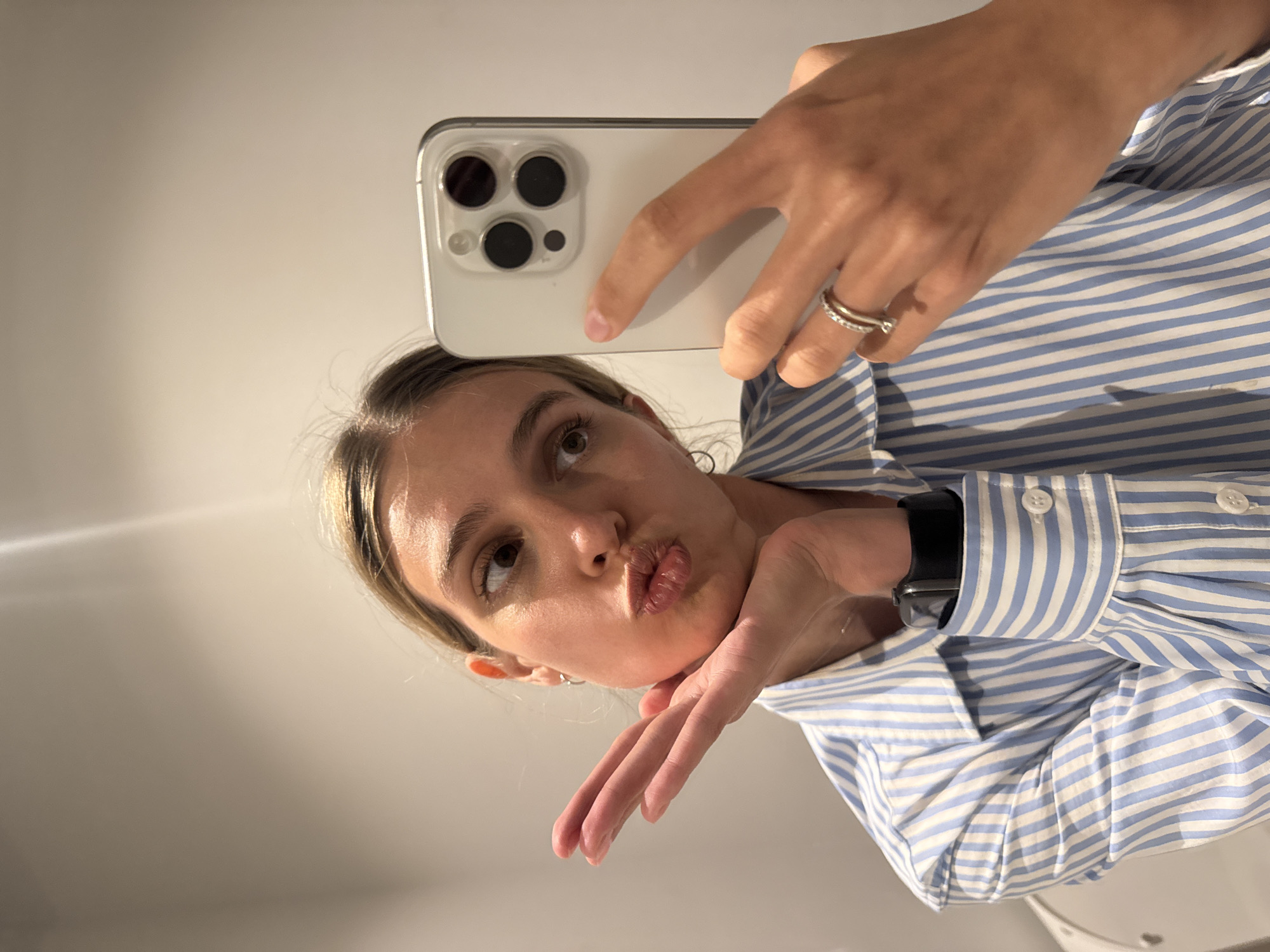 Woman takes mirror selfies in Tbilisi apartment
