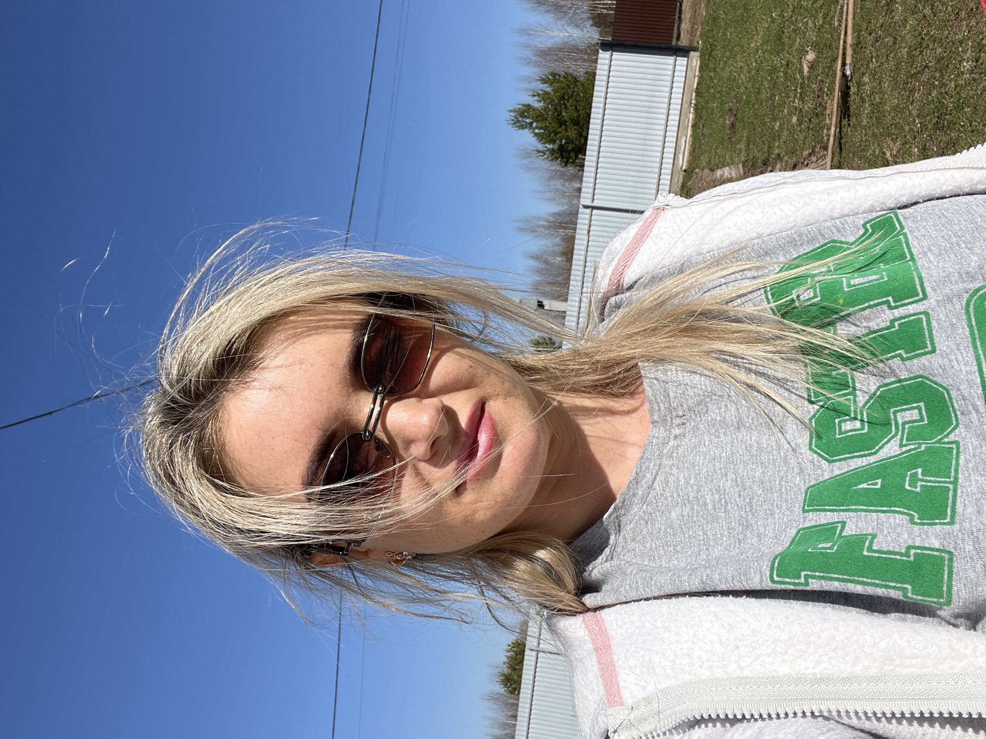 Woman takes selfie near outdoor grill in Гаревая, Russia
