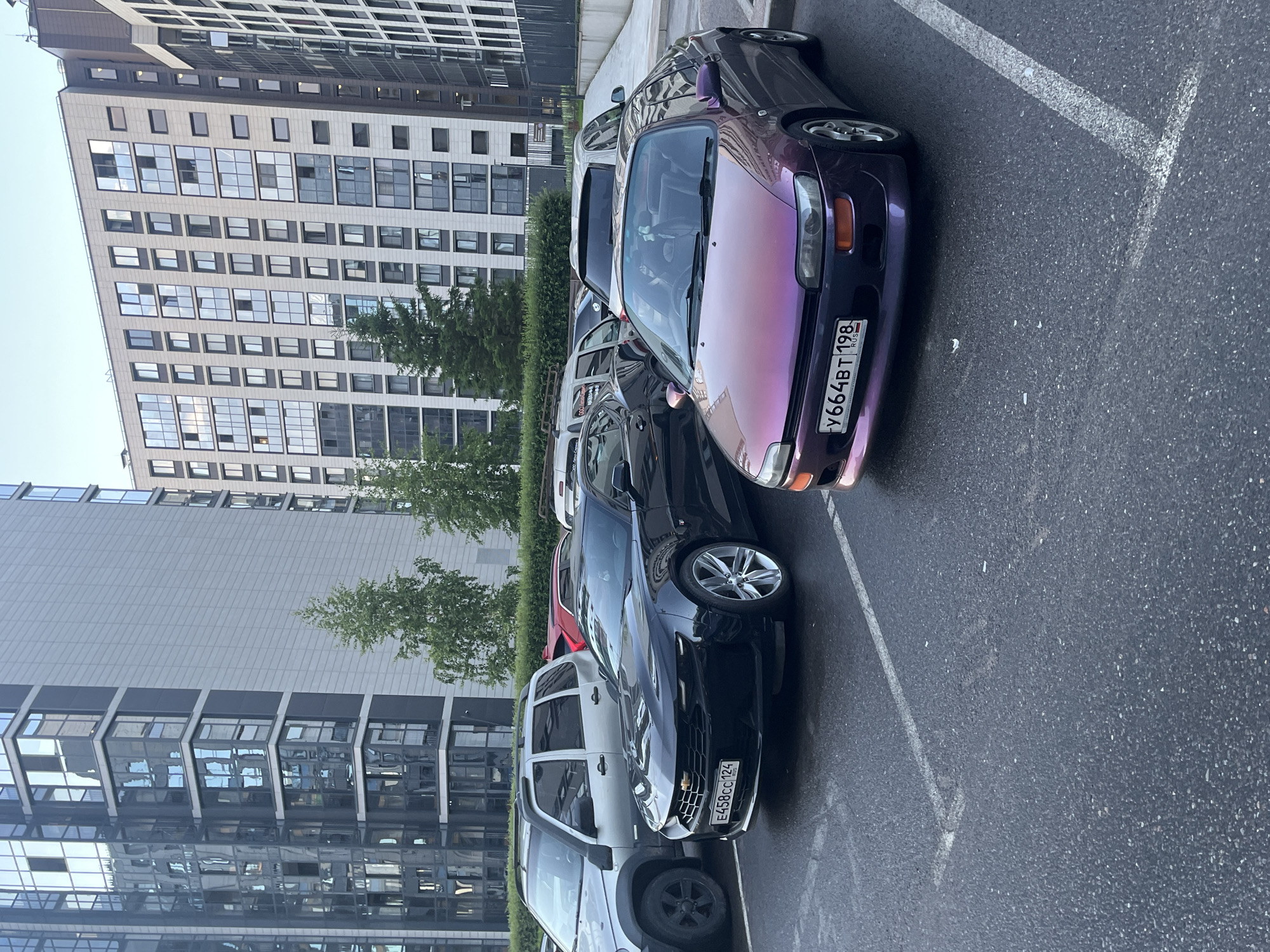 Cars parked outside modern buildings in Russia