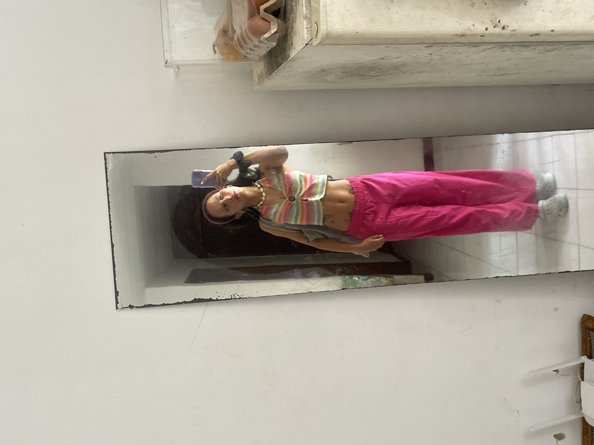 Mirror selfie session in a Porlamar home, bold outfit