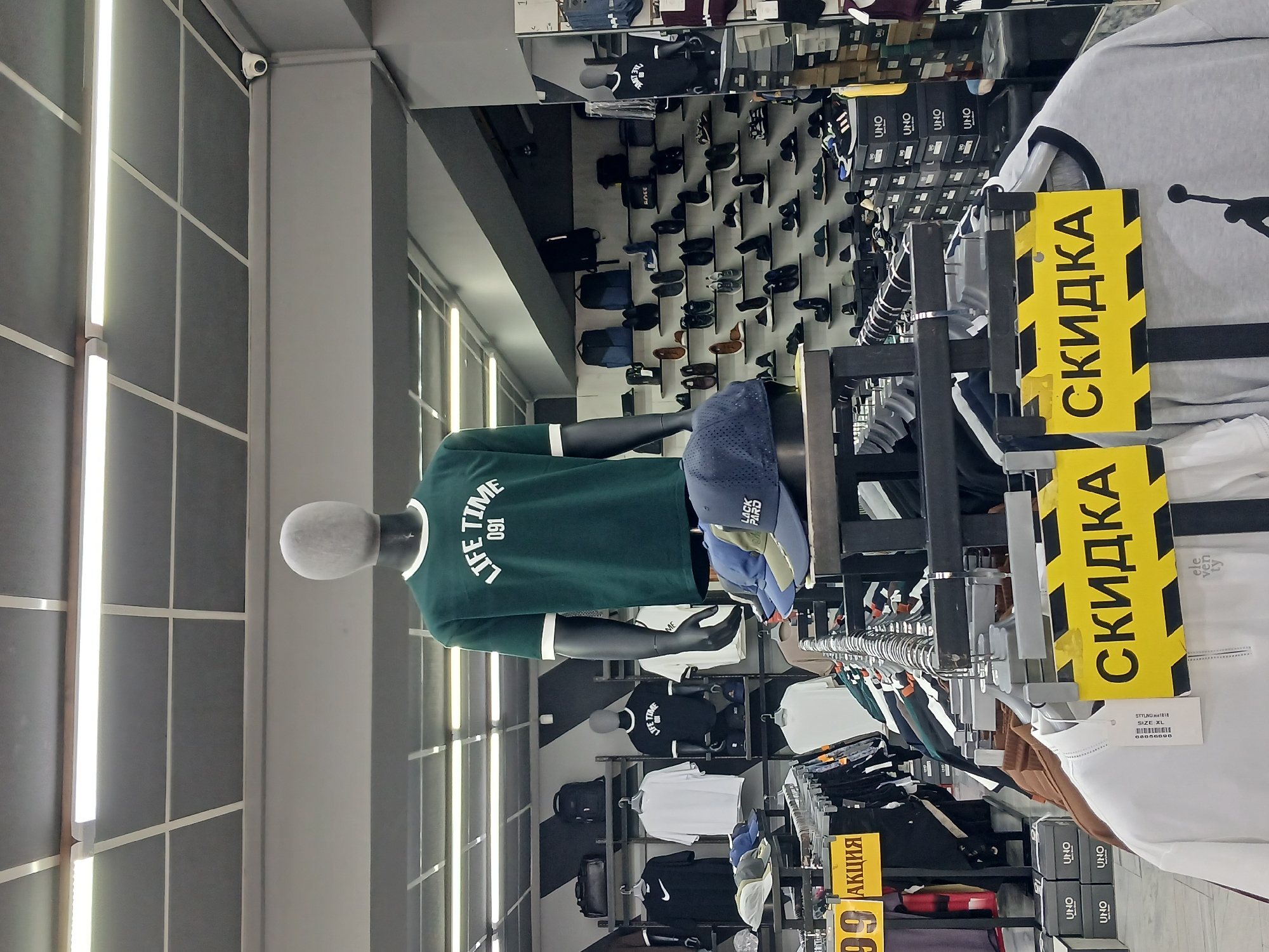 Inside a Tashkent retail store: clothing, shoes, and accessories