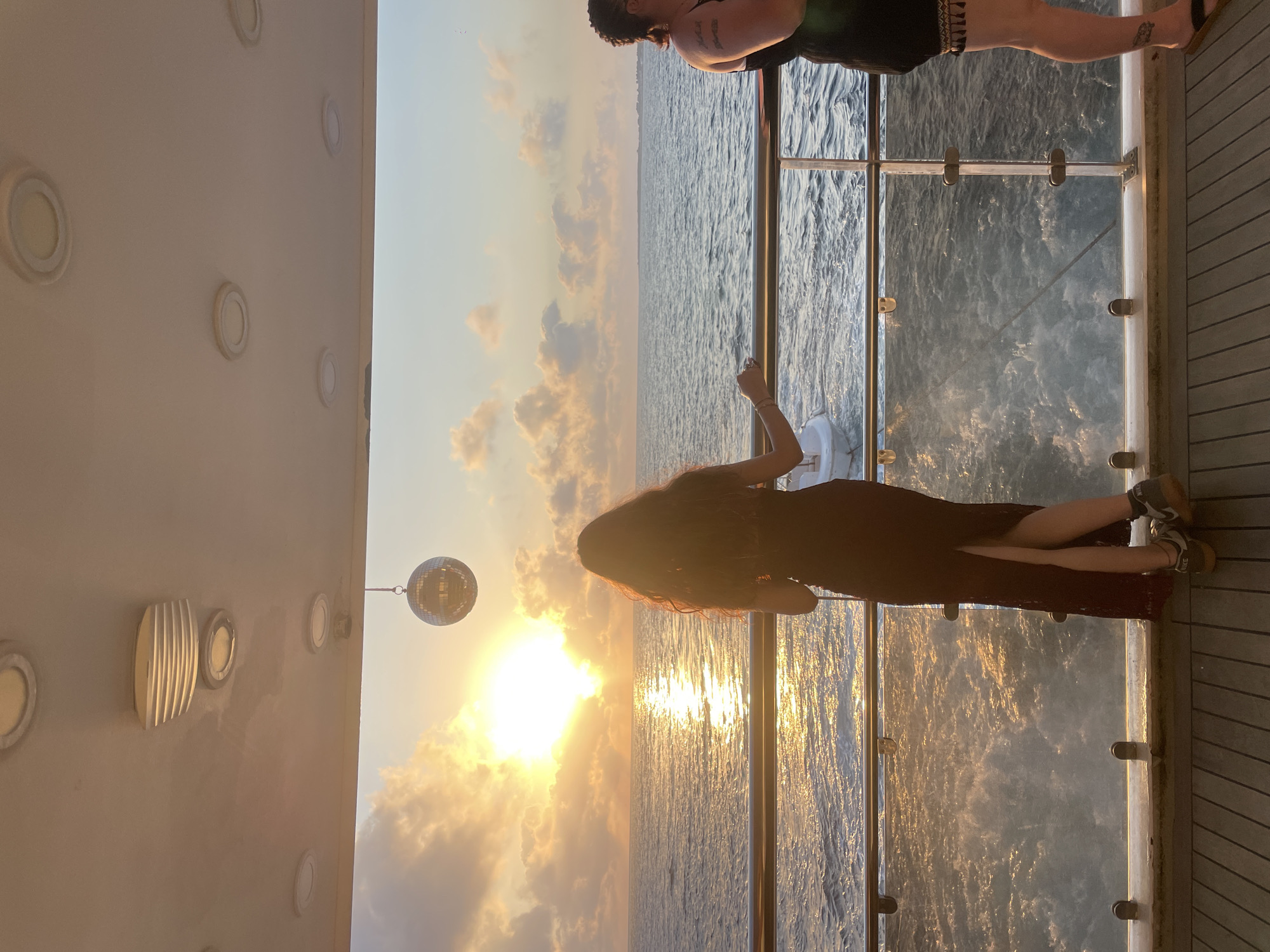 Sunset on a Cyprus boat deck, disco ball and golden light