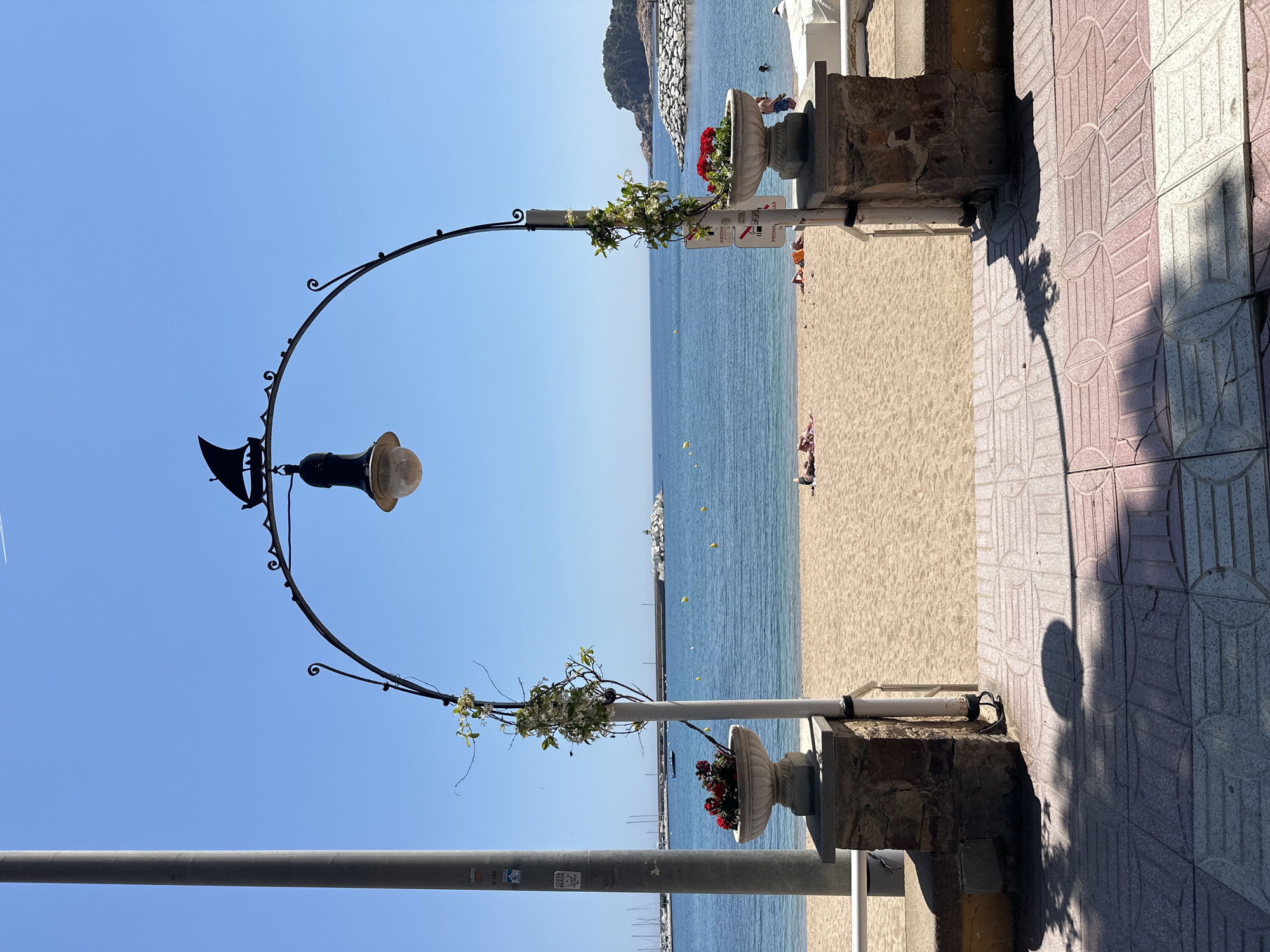 Tourist captures street scenes in Sant Feliu de Guíxols