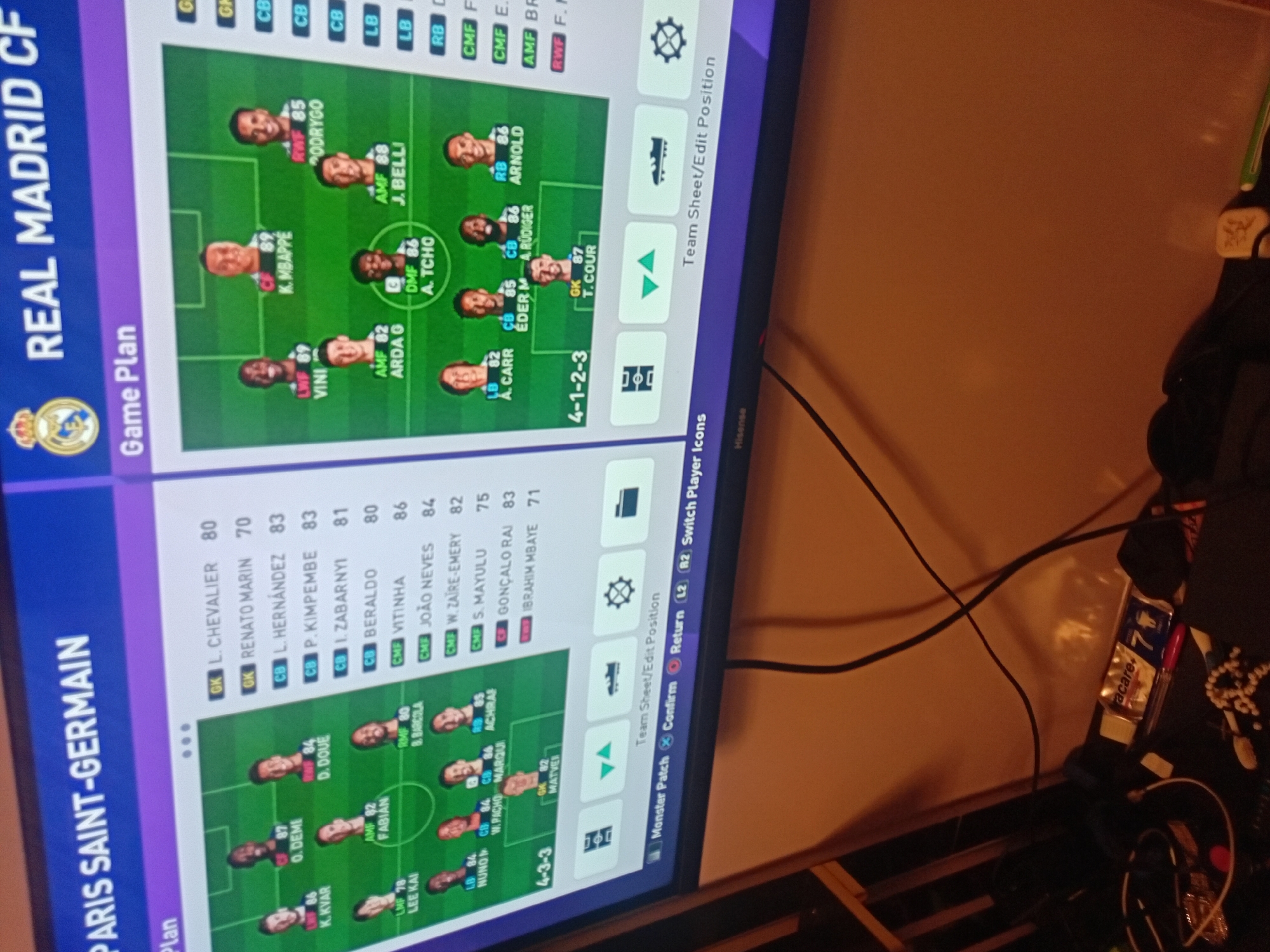 Person plays football video games on PlayStation during evening session