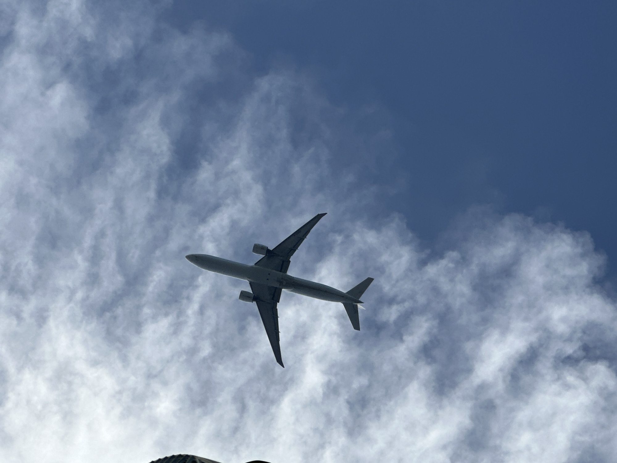 Commercial jet tracked from below over Miami Beach skies