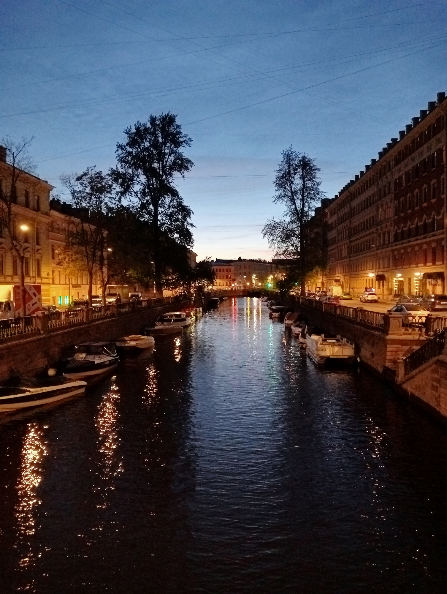 Evening canal life captured across Saint Petersburg during white nights