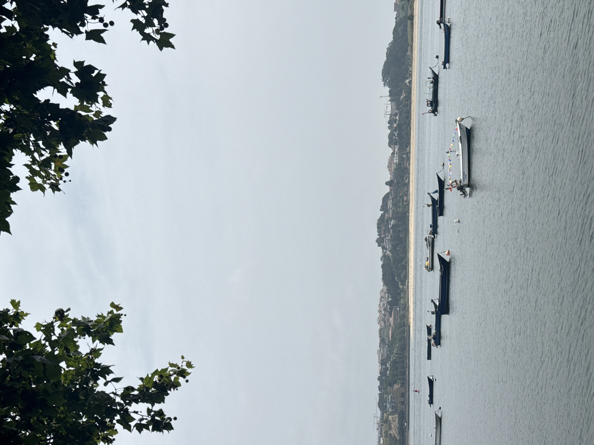 Boats moored along Porto's Douro River on a summer afternoon