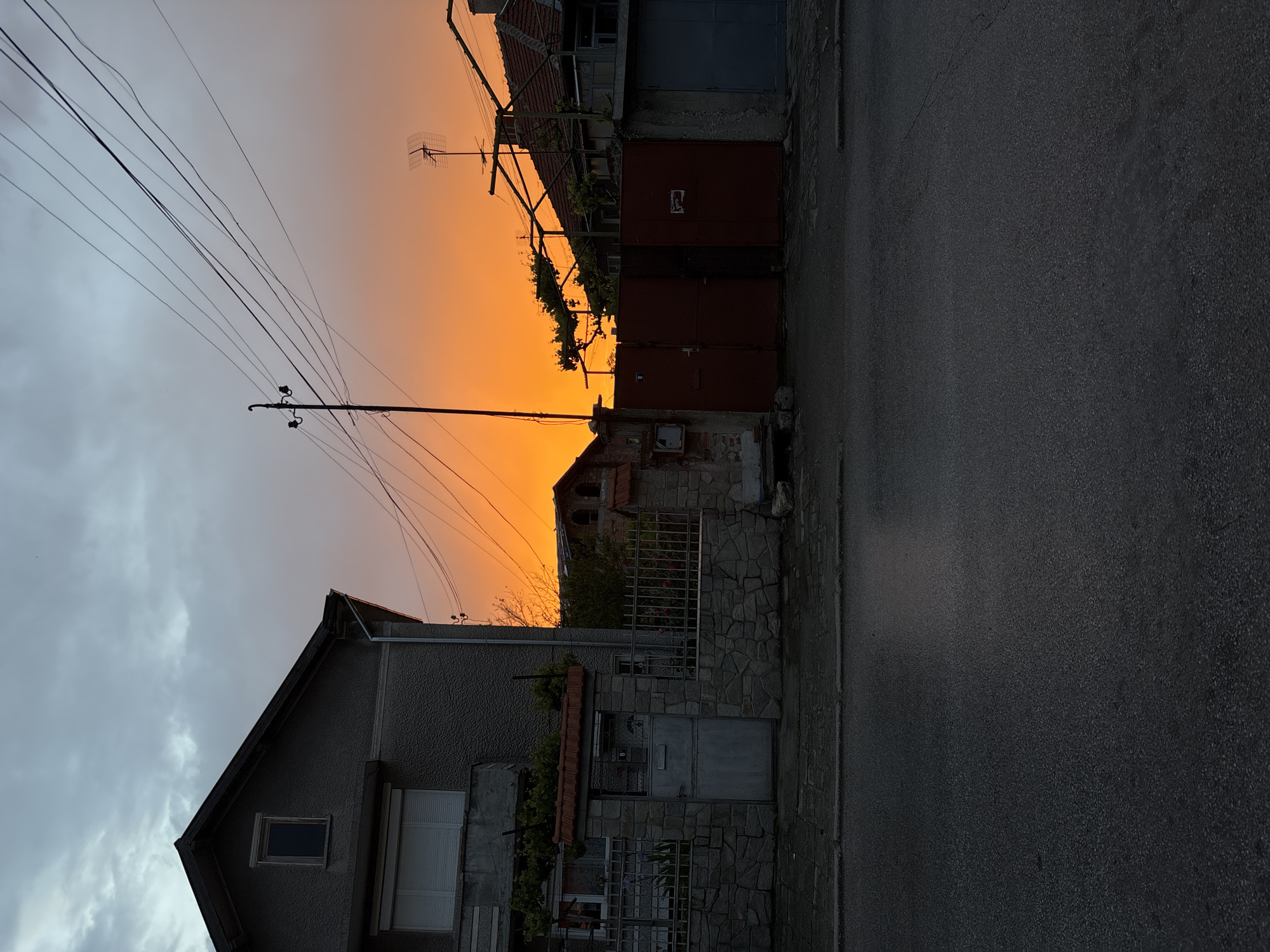 Dusk settles over residential street in Chirpan, Bulgaria