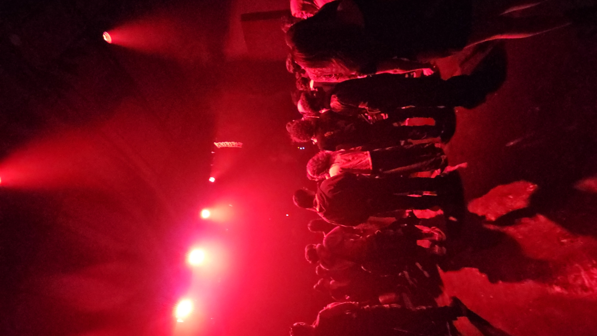 Dense crowd gathered under red stage lights in Buenos Aires
