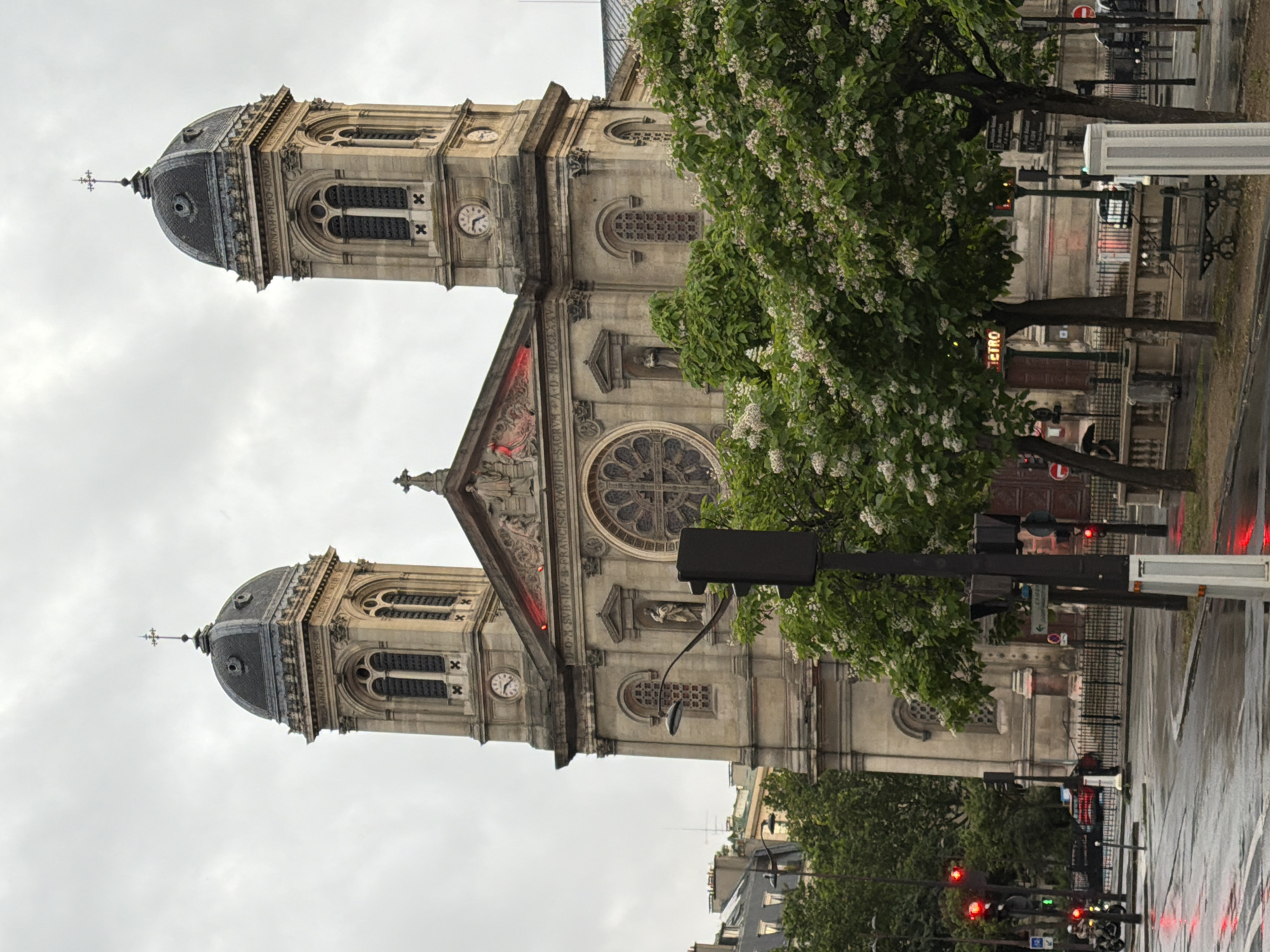 Tourist with Eiffel Tower umbrella walks rainy Paris streets