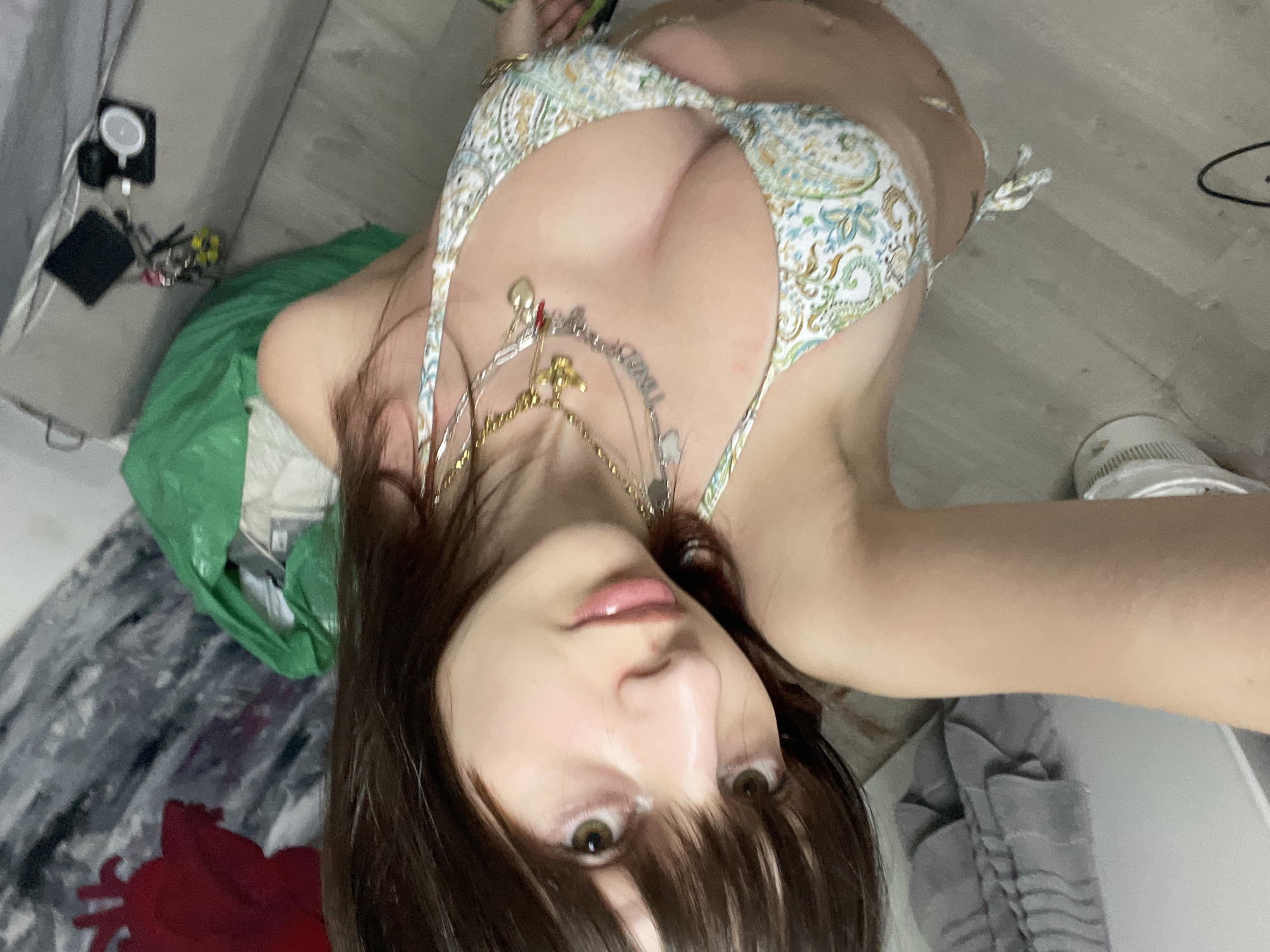 Woman Takes Multiple Bikini Selfies in Art-Decorated Room