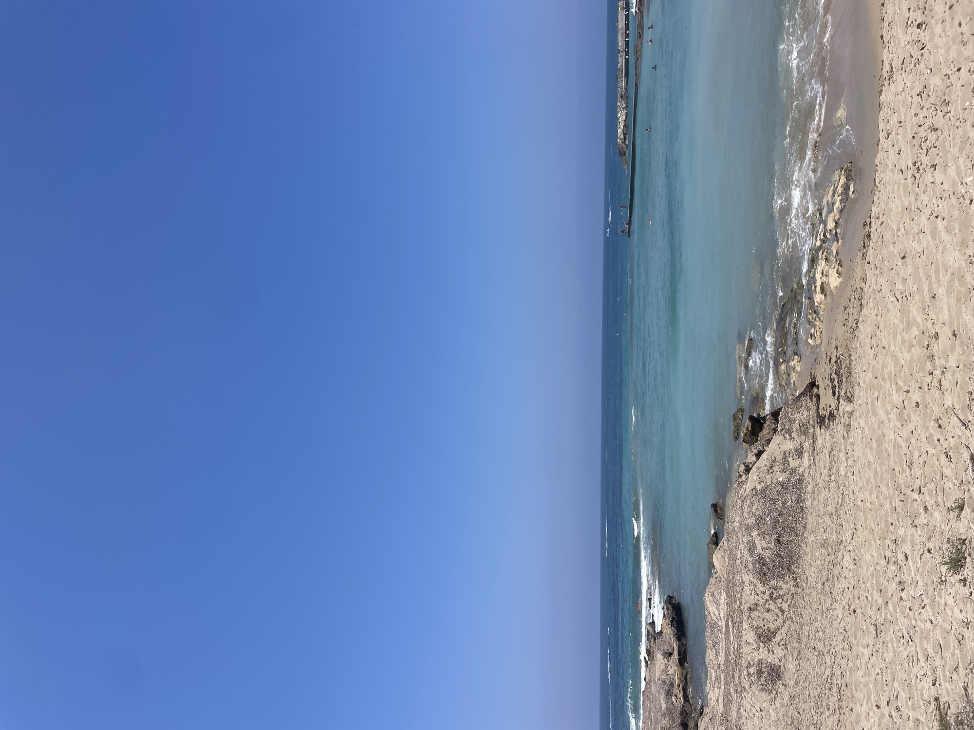 Sunny morning at a Paphos beach, Mediterranean shore in focus
