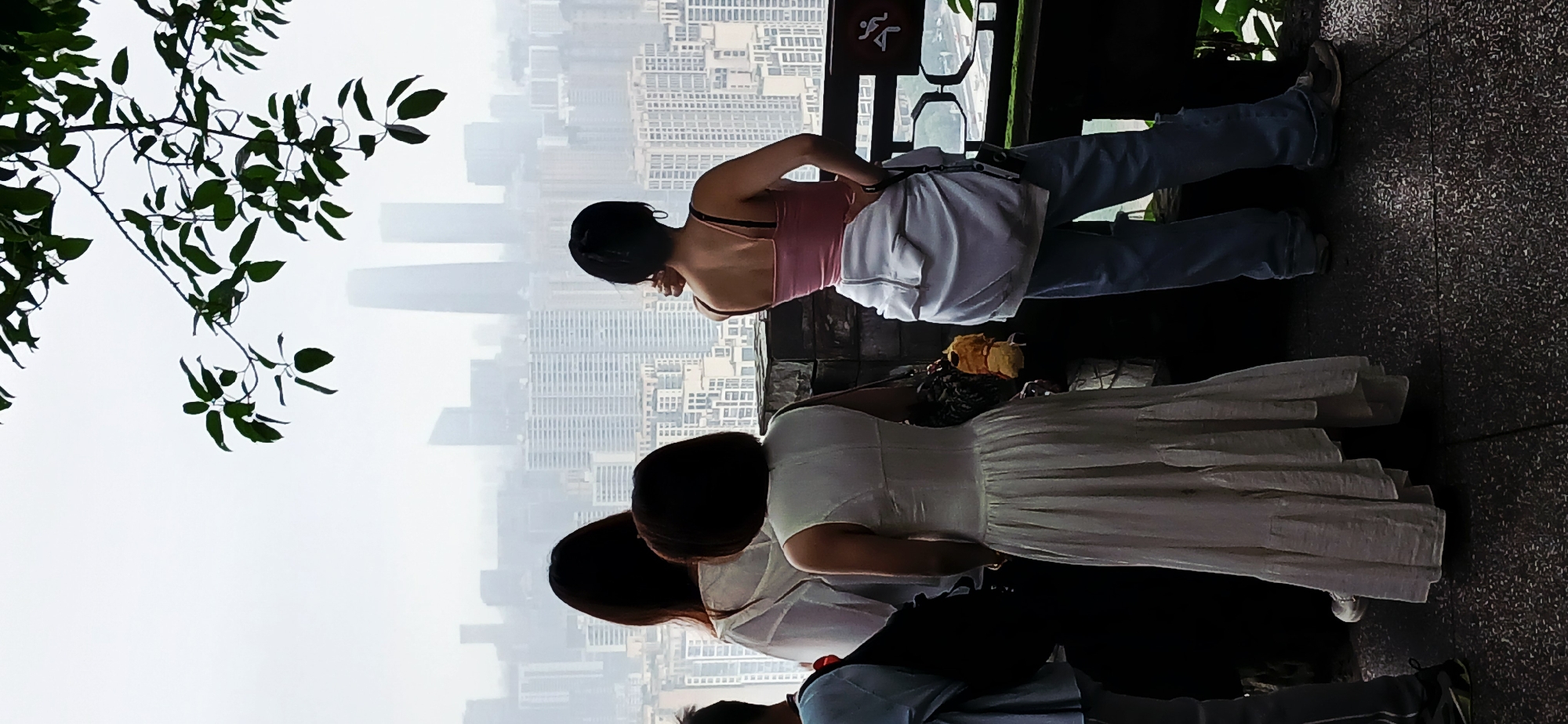 Tourists gather at misty Yuzhong District viewing platform