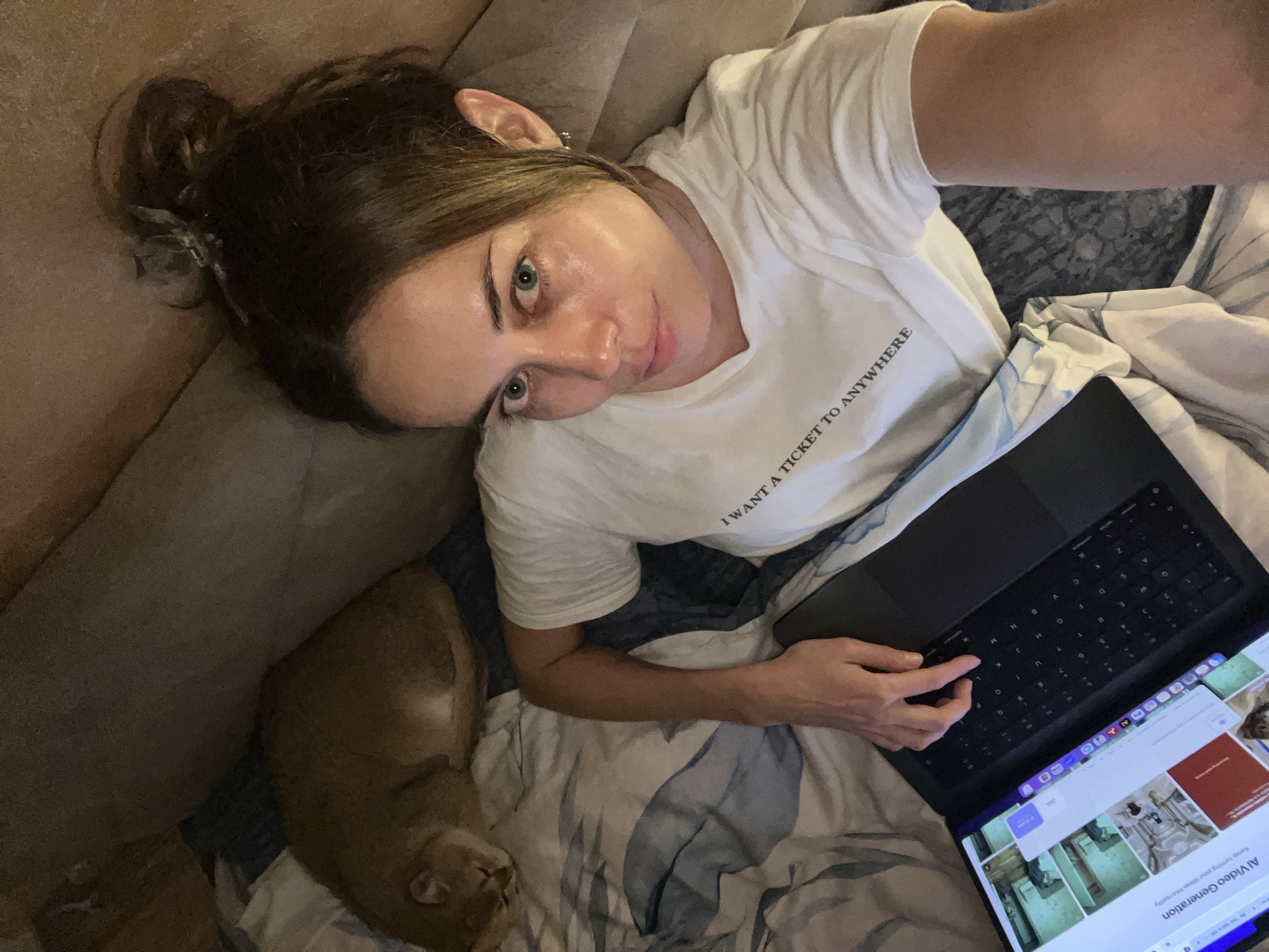 Woman uses AI video software while wearing travel-themed shirt