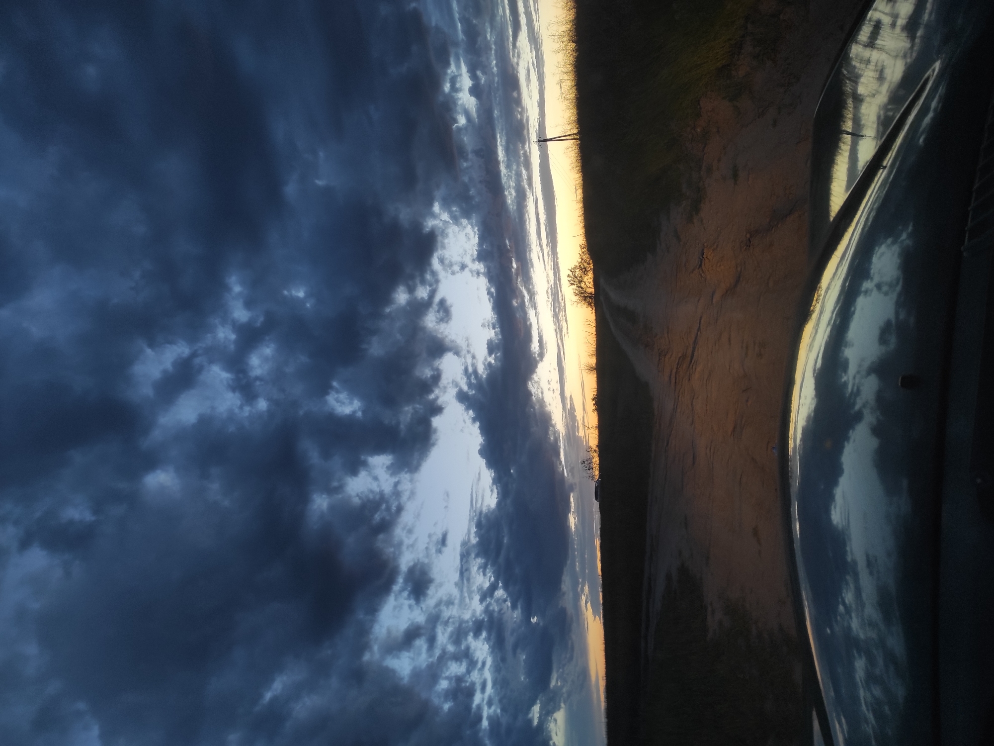 Aurora Colorado witnesses document stormy sunset, vintage cars