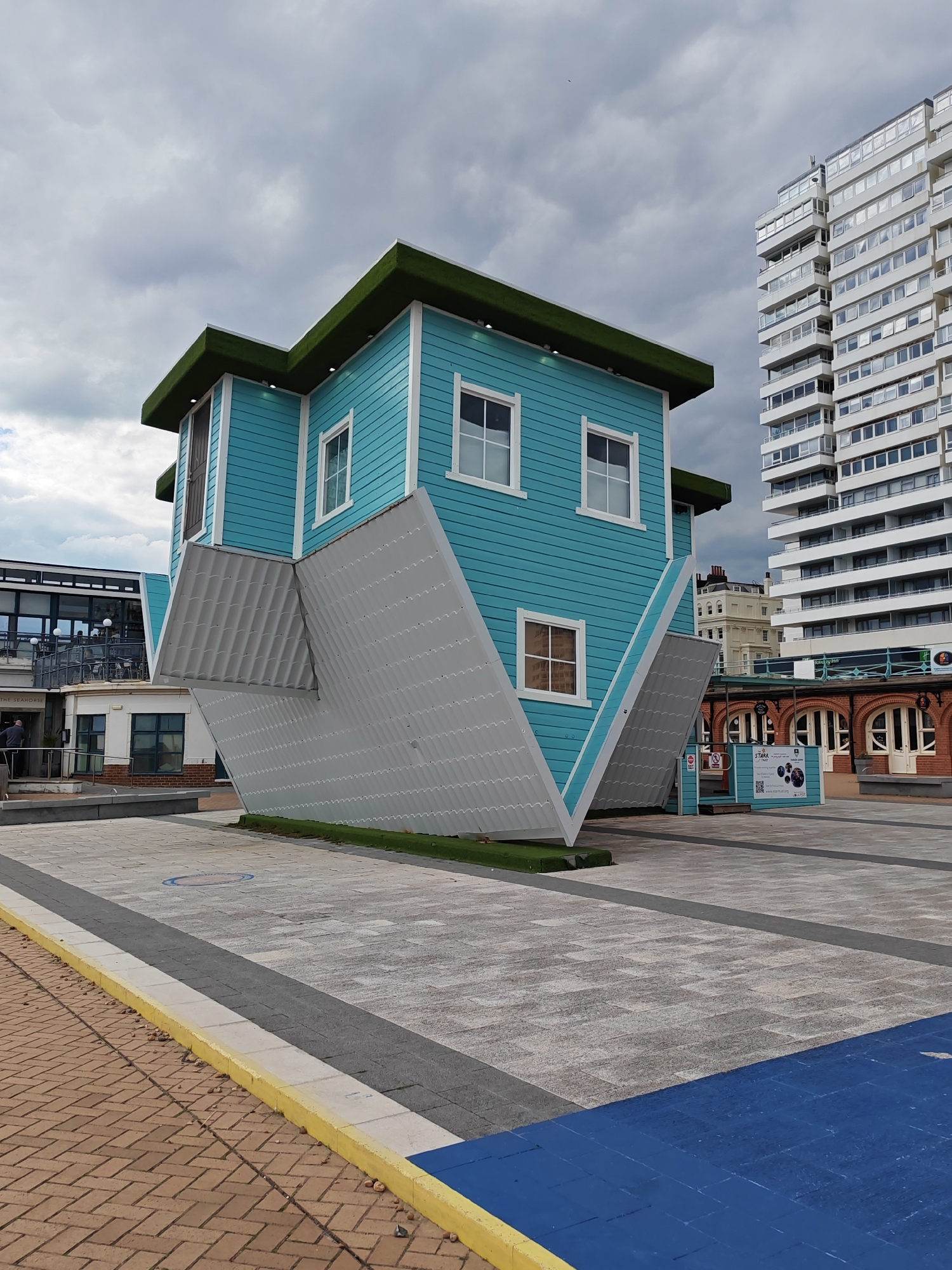 Brighton landmarks West Pier ruins and Upside Down House documented