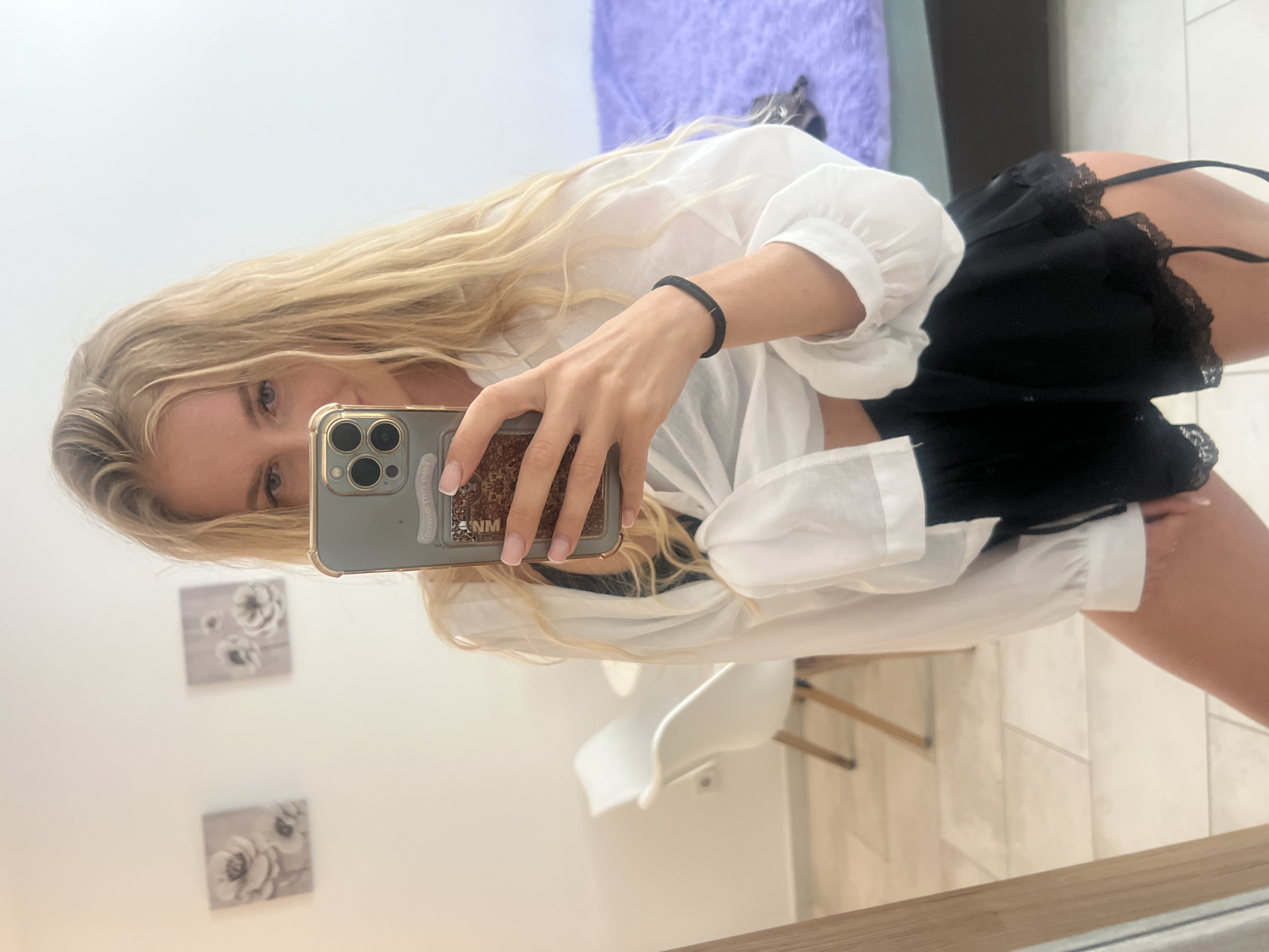 Woman takes mirror selfies in Budva, Montenegro