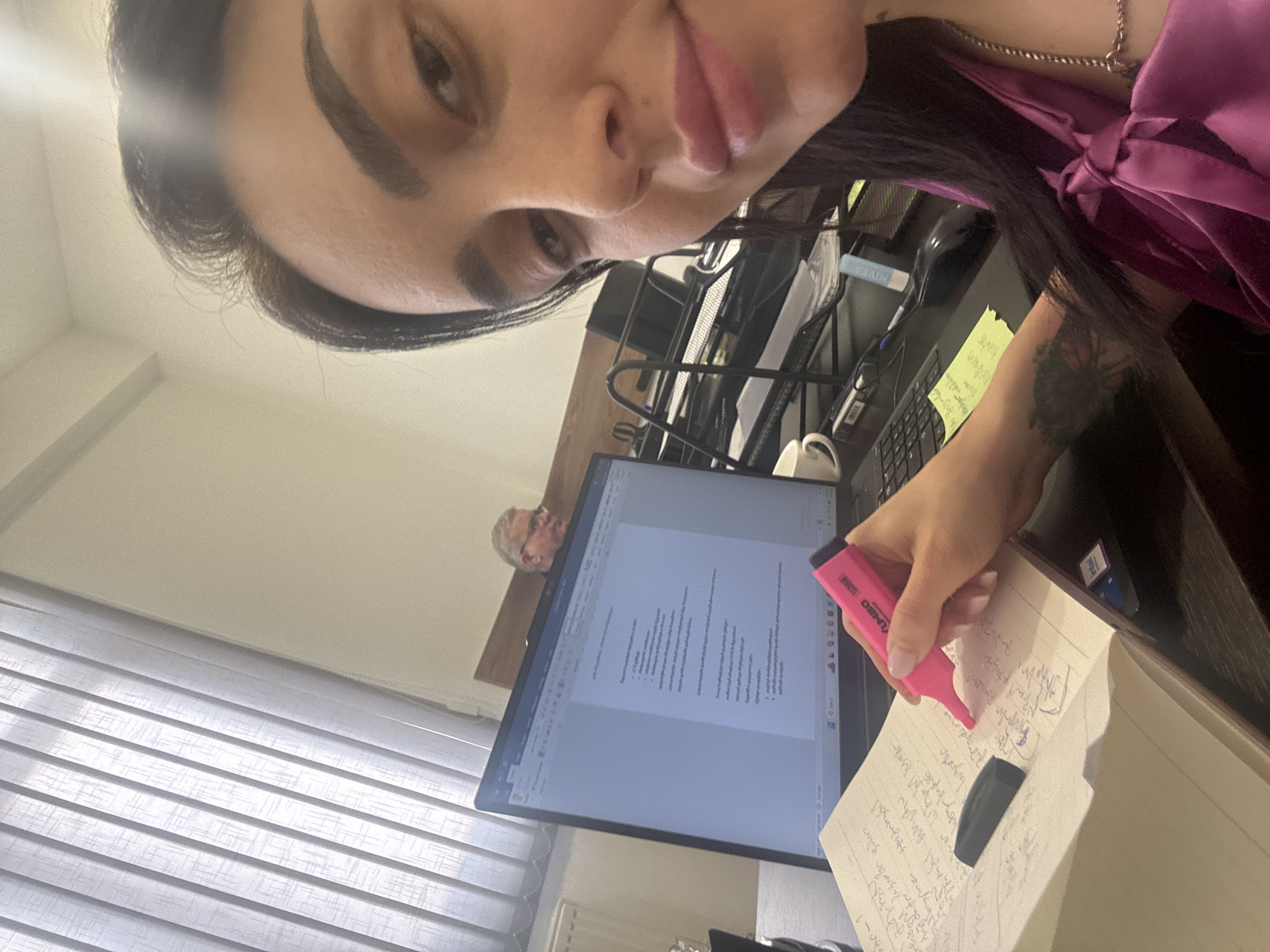 Woman documents work session with Georgian notes in Tbilisi