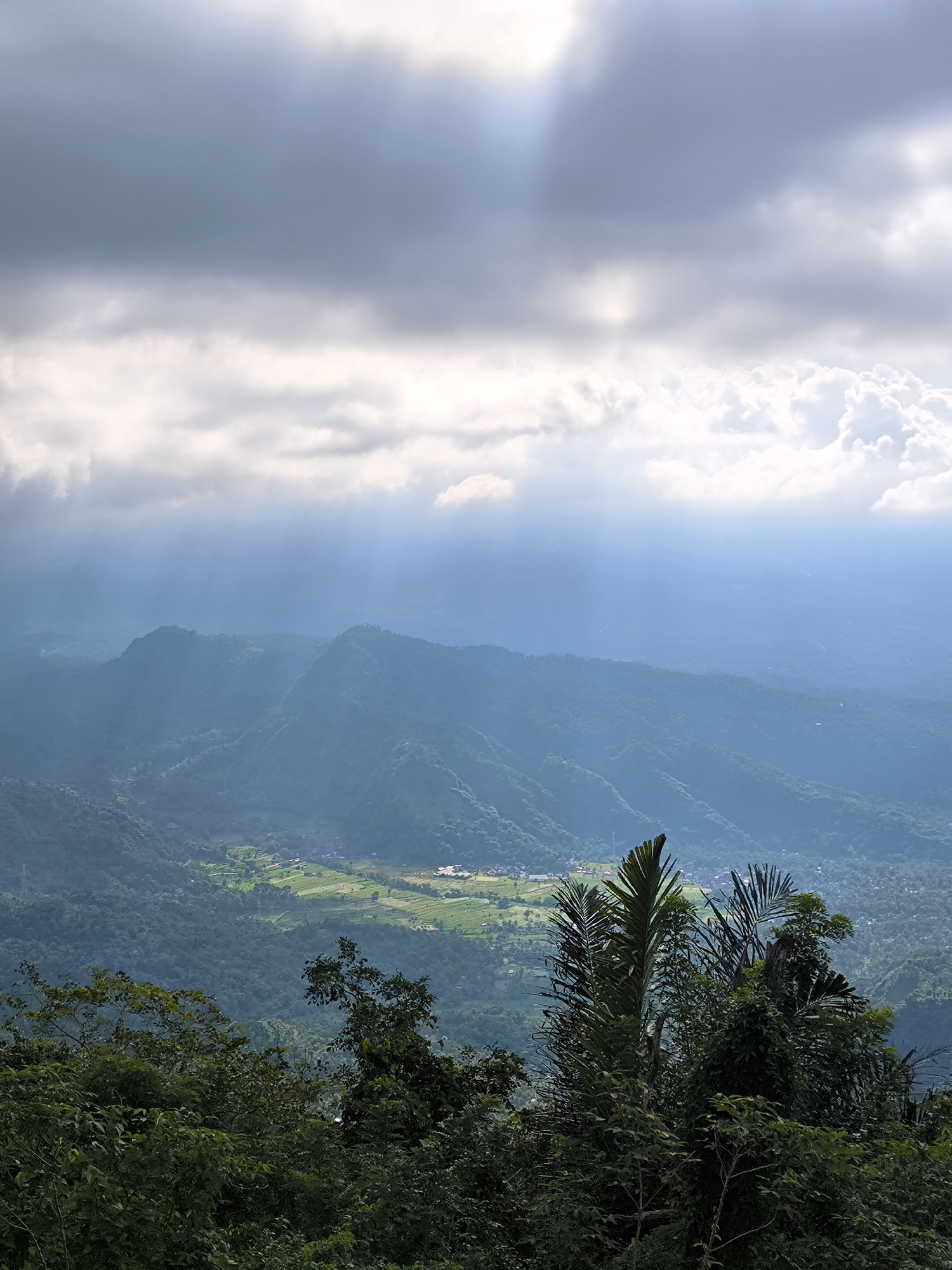 Wooden observation platform documented overlooking mountains near Abang, Indonesia