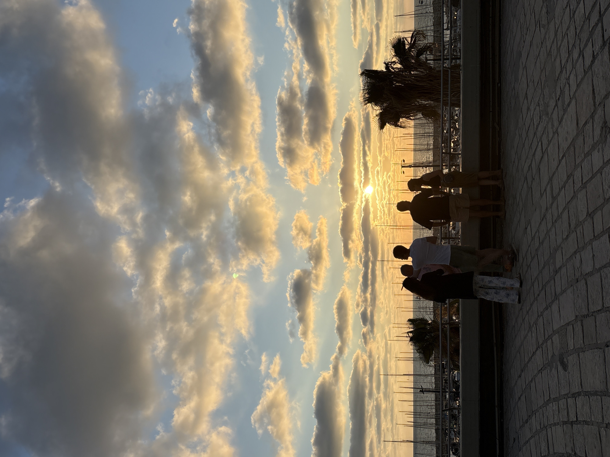 Tel Aviv residents enjoy sunset activities across city promenade