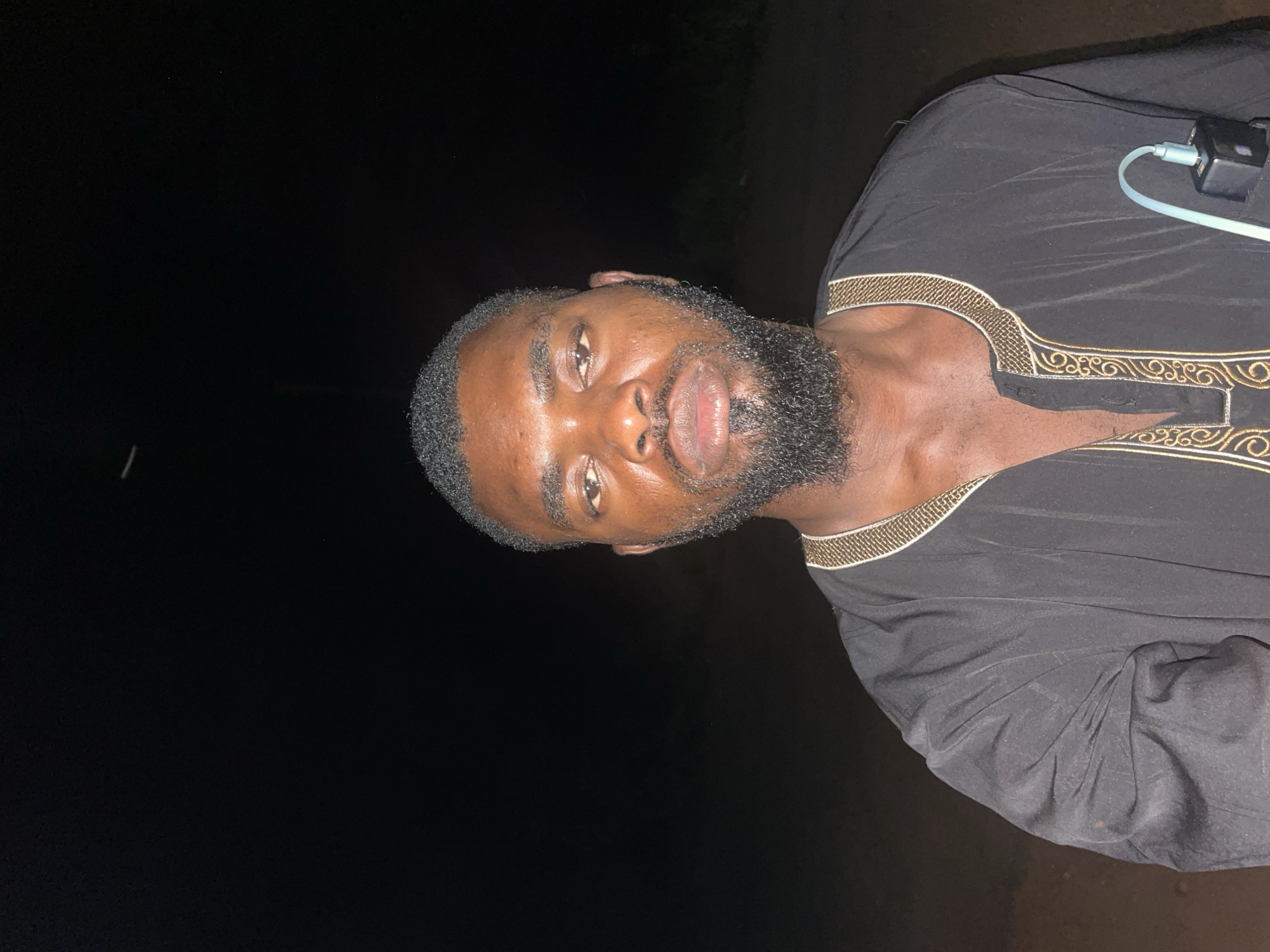 Nighttime photos capture two people together in Ogbe, Nigeria