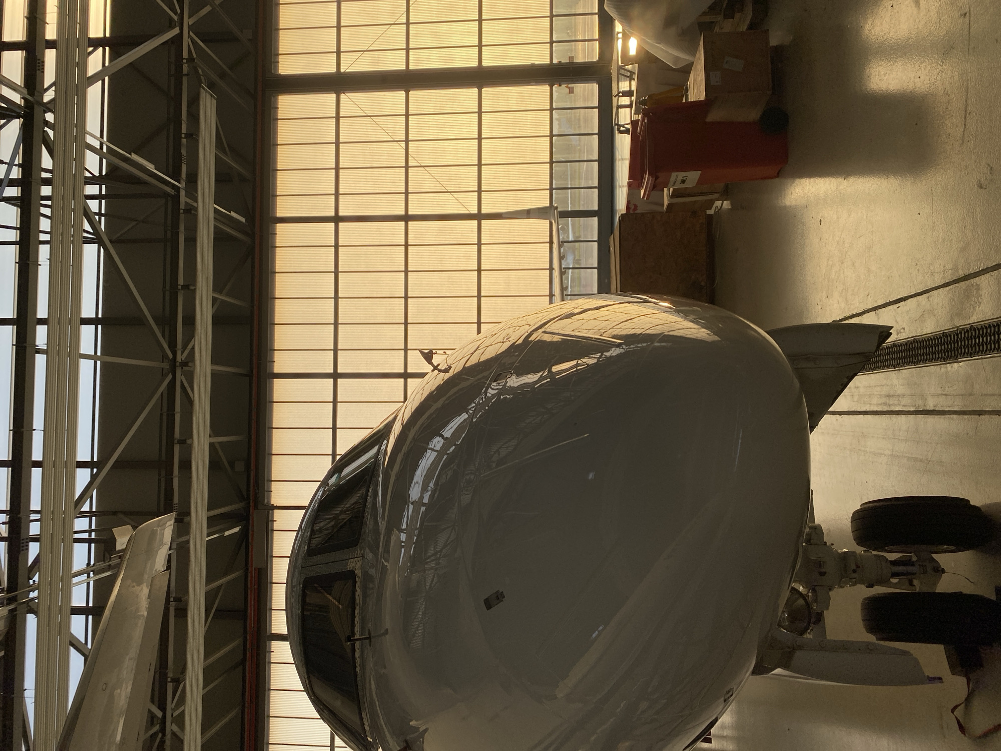 White aircraft documented in hangar at Skulte, Latvia