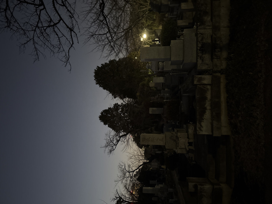 Cemetery scene documented in Minato during evening hours