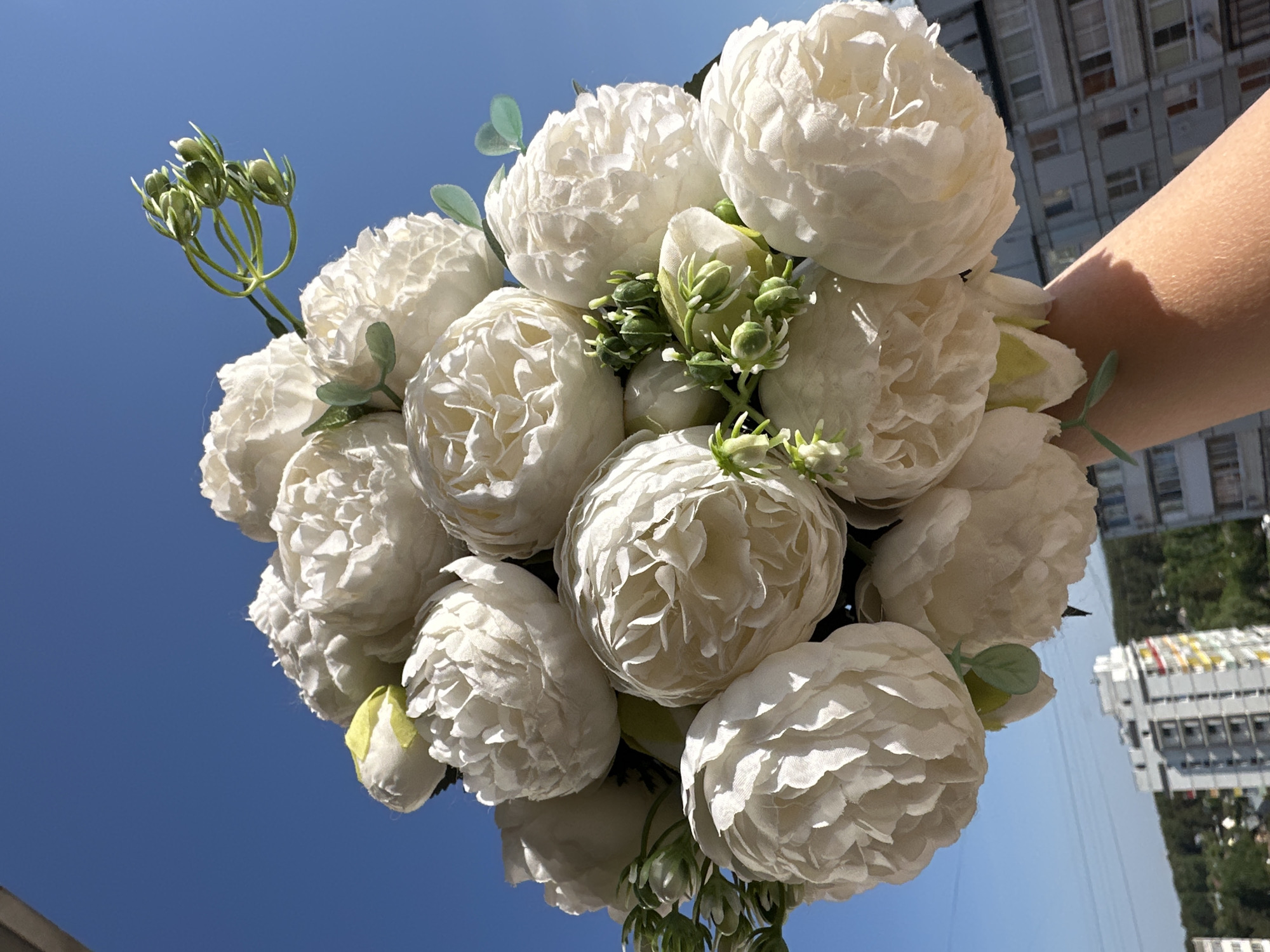 Woman photographed with white flowers in Chaikovsky, Russia