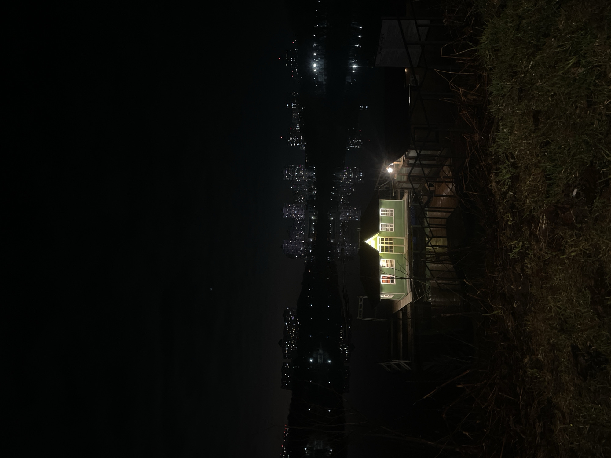 Nighttime scene captured in Ramenskoye showing illuminated waterfront building