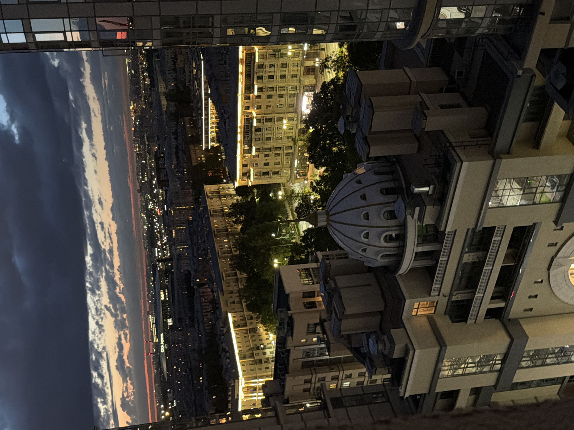City skyline at dusk, then homemade syrniki in the kitchen
