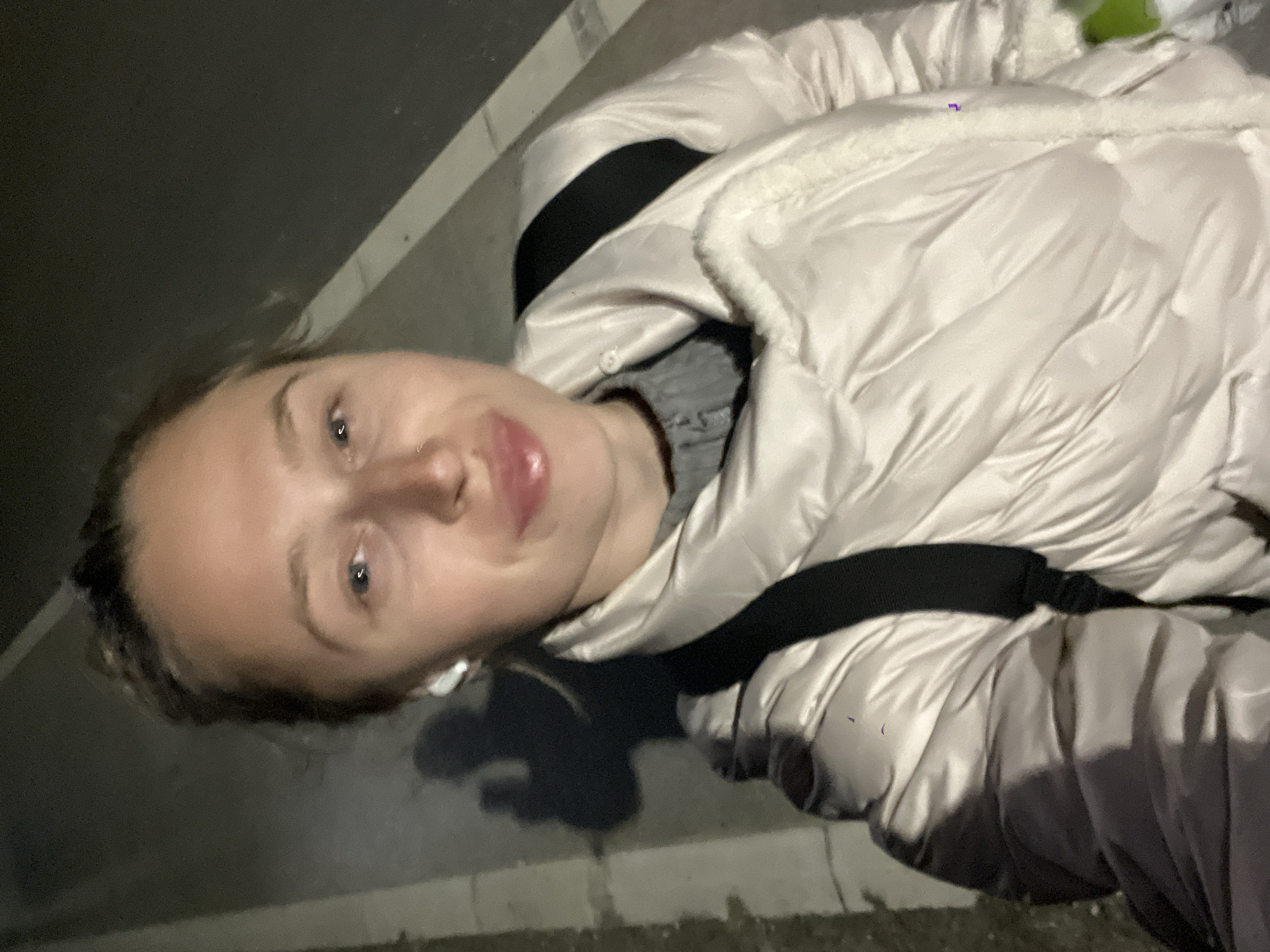 Woman takes selfie in white jacket in Boreti, Montenegro