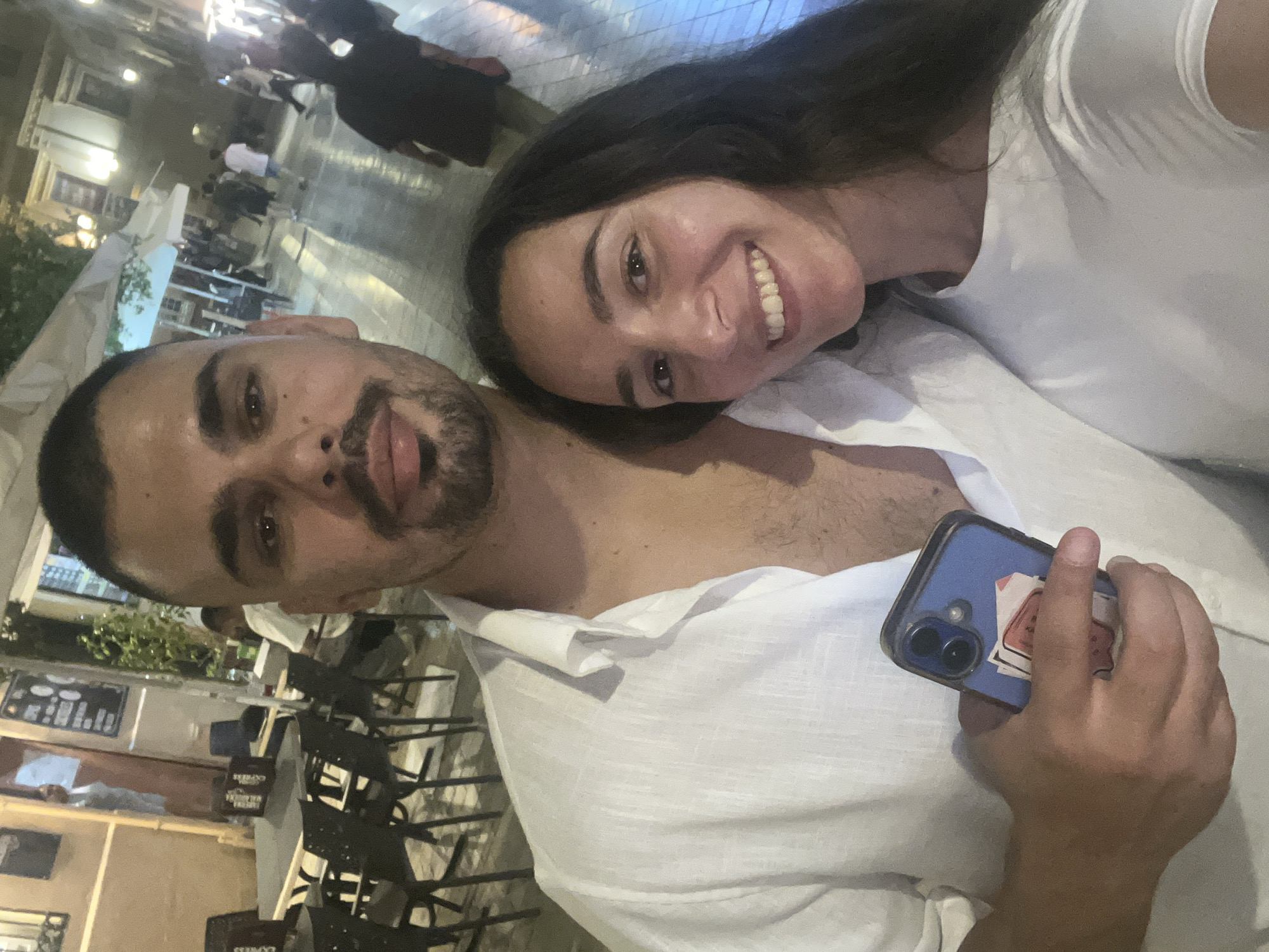 Couple Takes Evening Selfies on Málaga Street