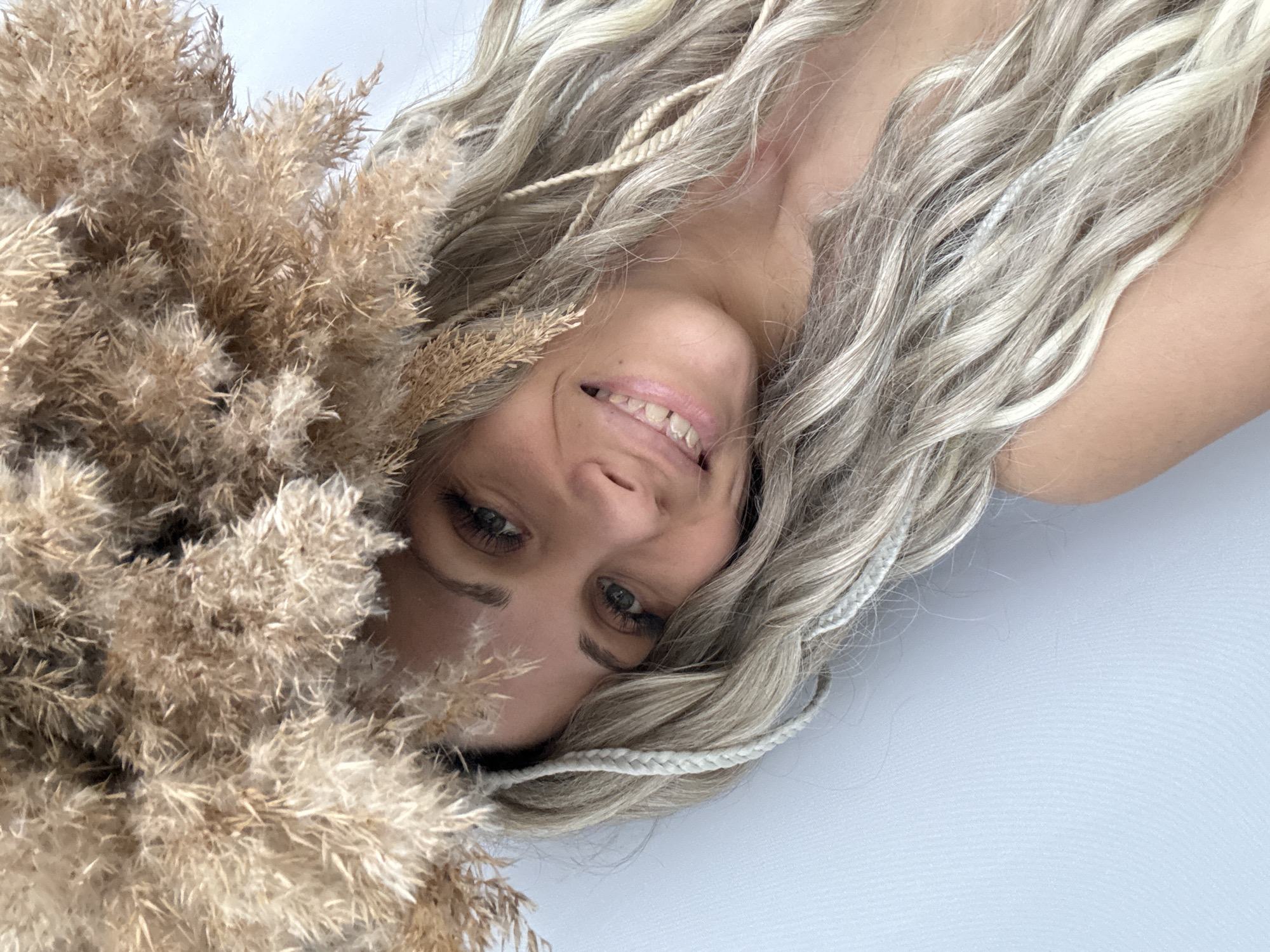 Woman poses with pampas grass in Russian photo session