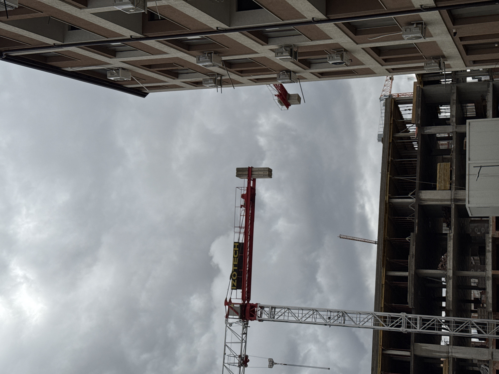 Construction crane operates among Sofia apartment buildings Friday morning