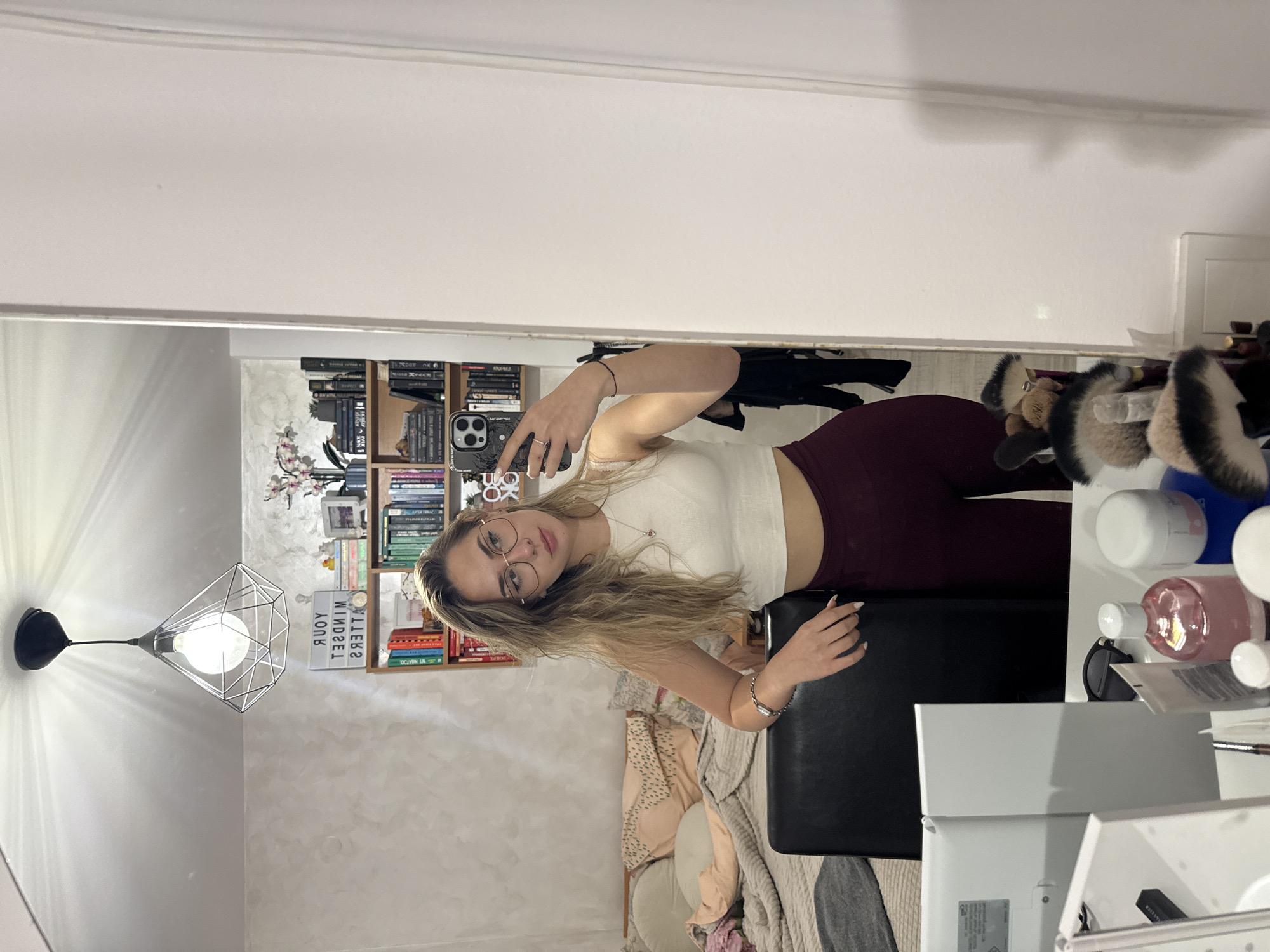Woman takes mirror selfie with flowers in Blagoevgrad
