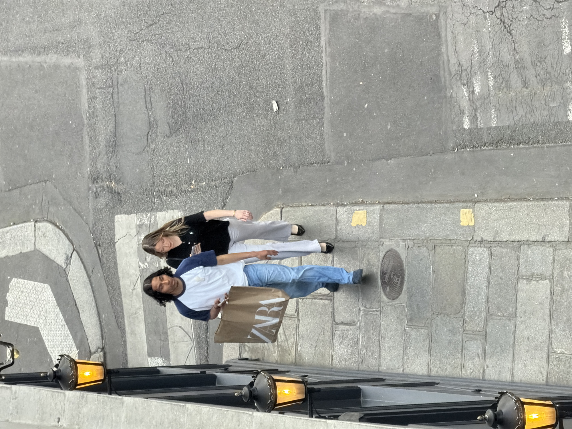 Everyday street life unfolds across central Paris during evening hours