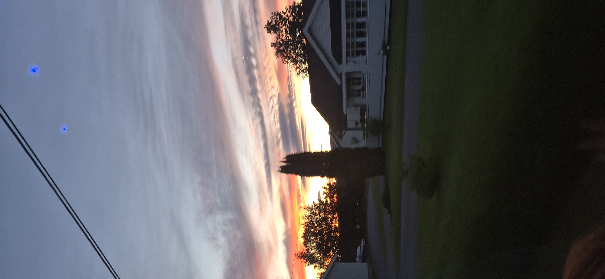 Vivid sunset sky over a residential area in Biri, Norway