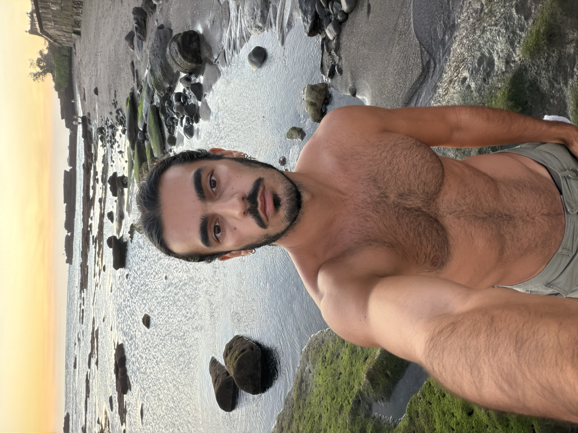 Solo traveler documents sunset selfie session on Indonesian coast