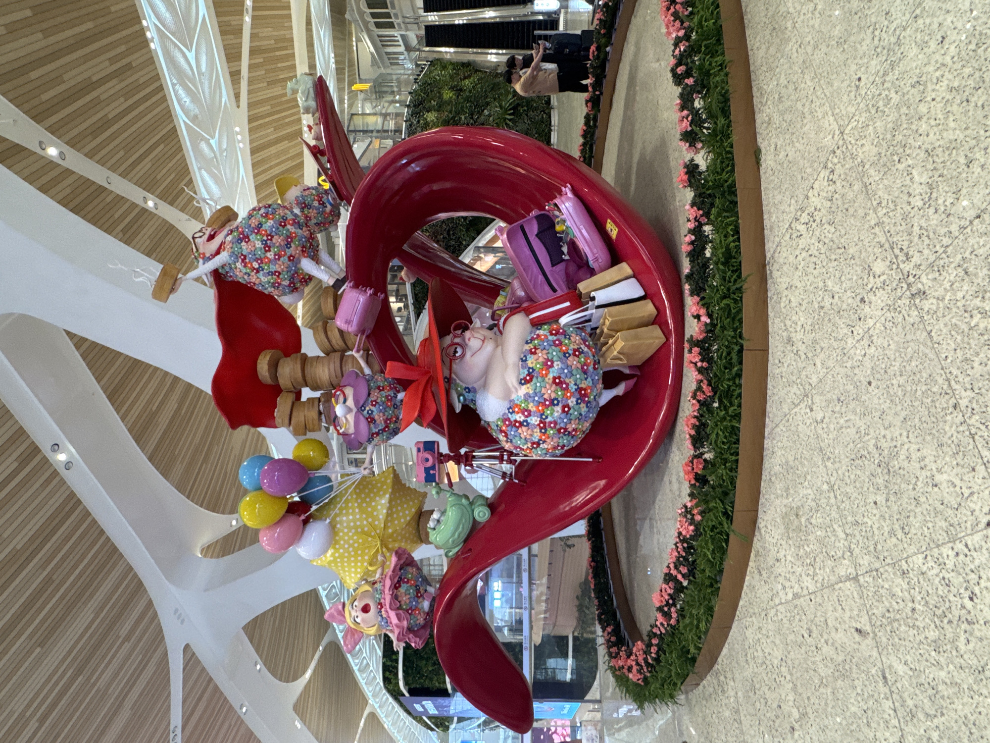 Airport visitor documents orchid displays and digital art installations