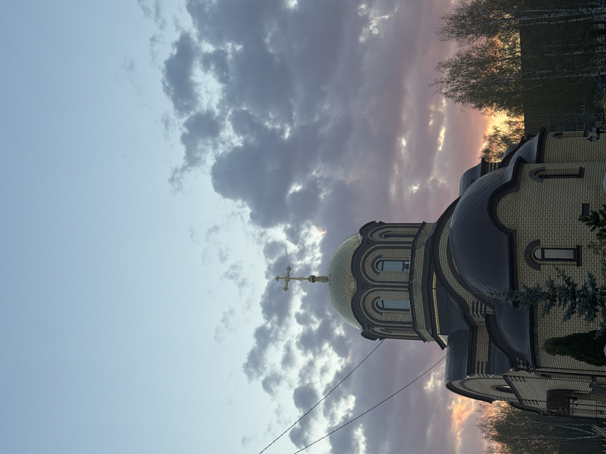 Observer documents Chernushka church and skyline during afternoon