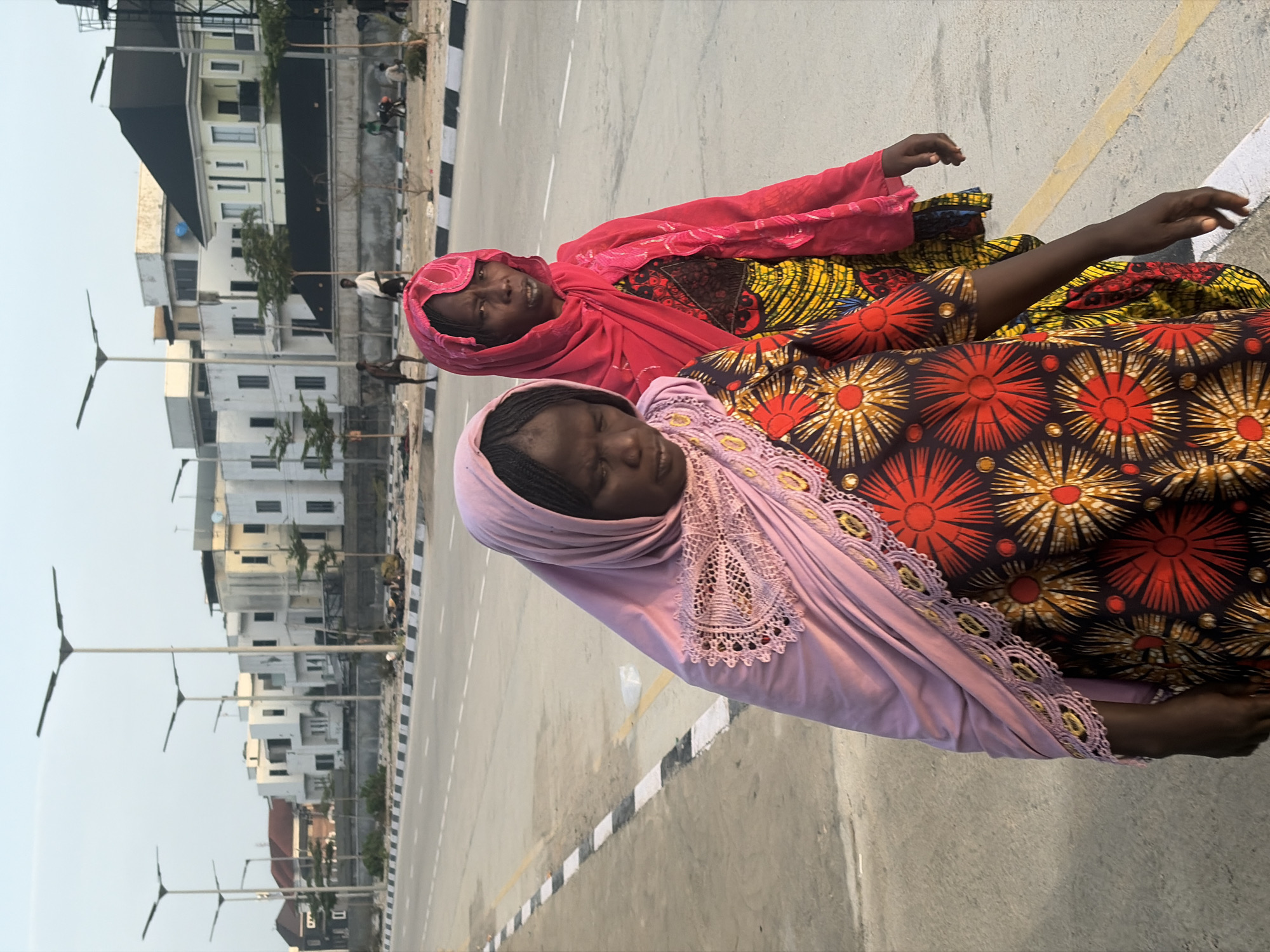 Women lying on roadside concrete observed in Alaguntan, Nigeria