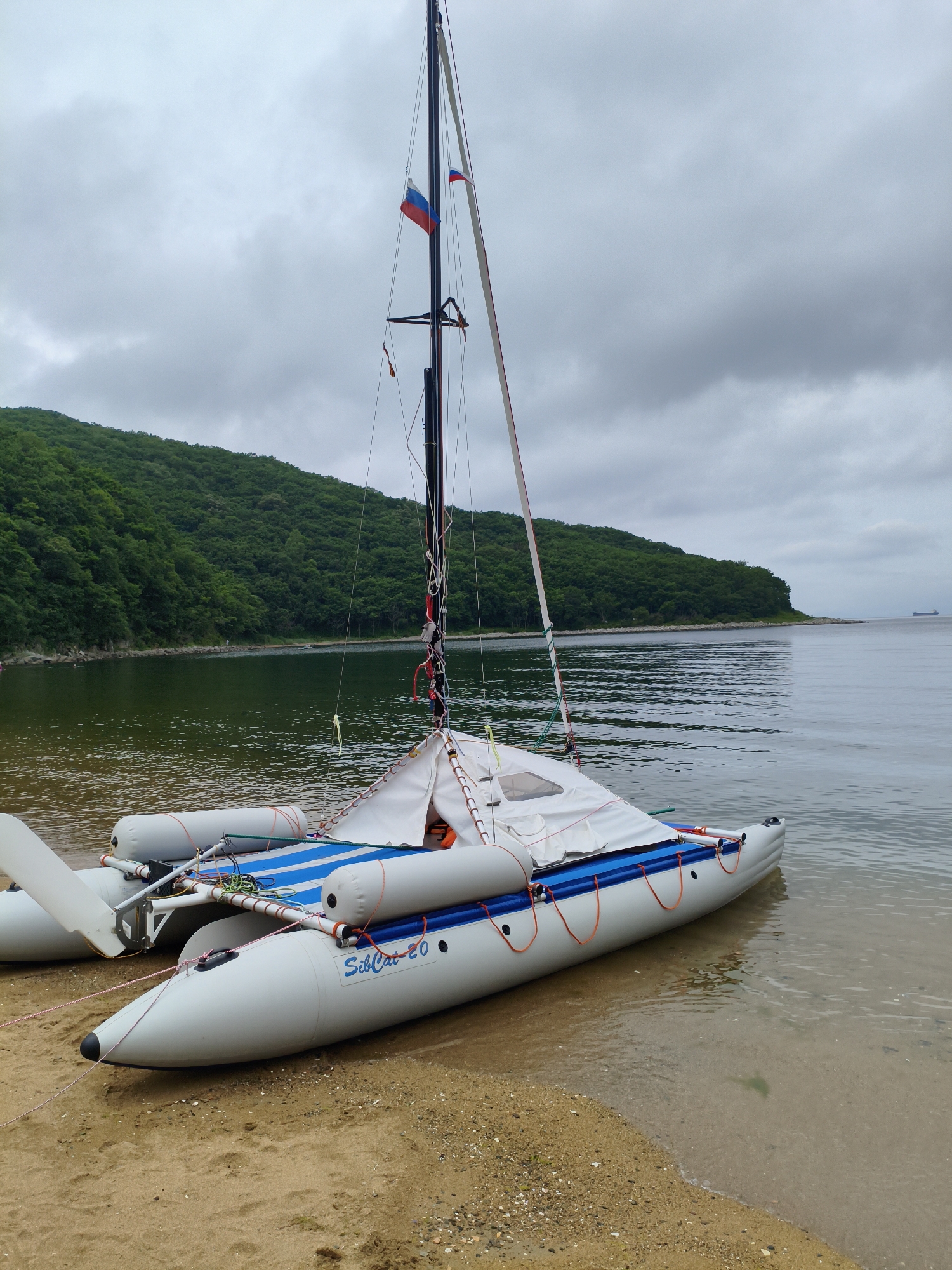 SibCat-20 inflatable catamaran parked on a Russian riverbank