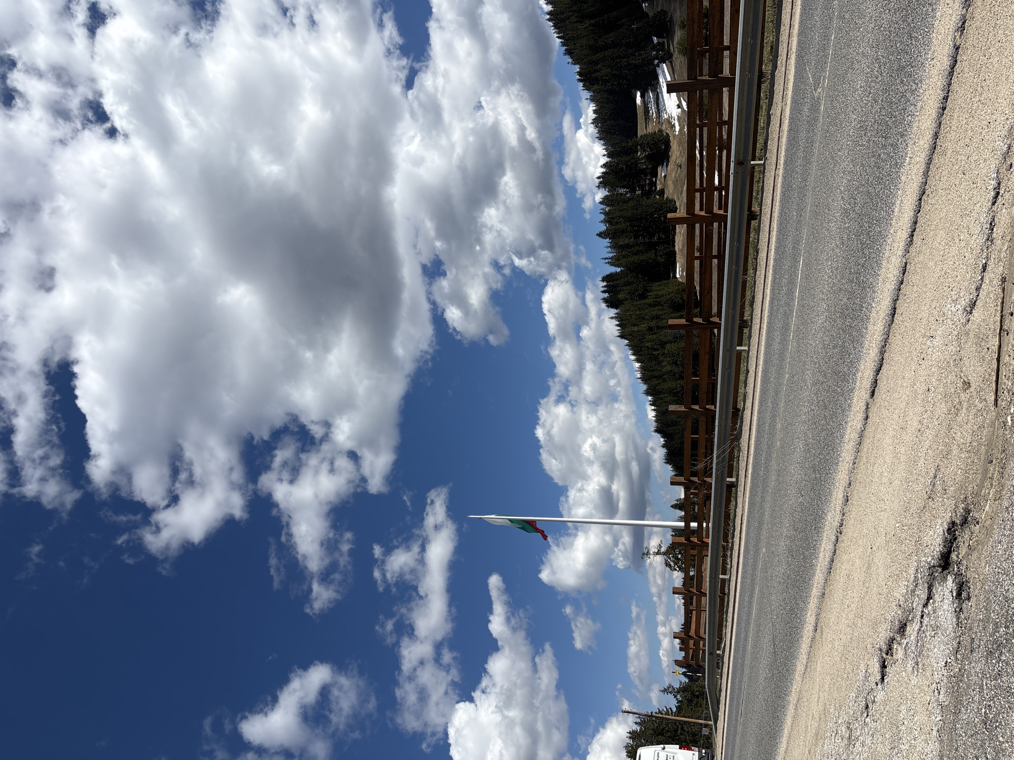 Bulgarian flag flies on flagpole in Smolyan landscape